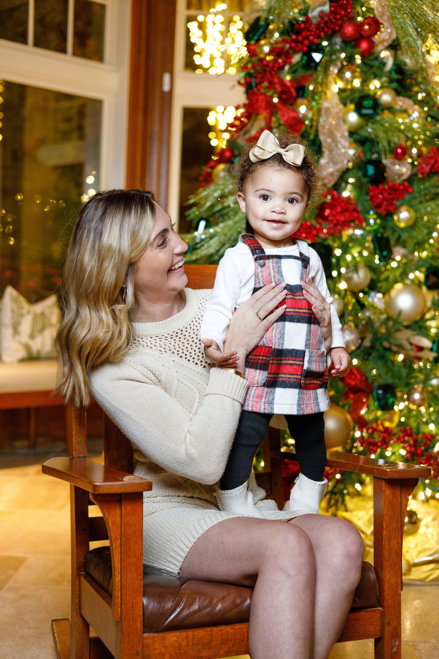 A series of holiday photos showing a cozy scene with a decorated Christmas tree, red poinsettias, and warm lighting.