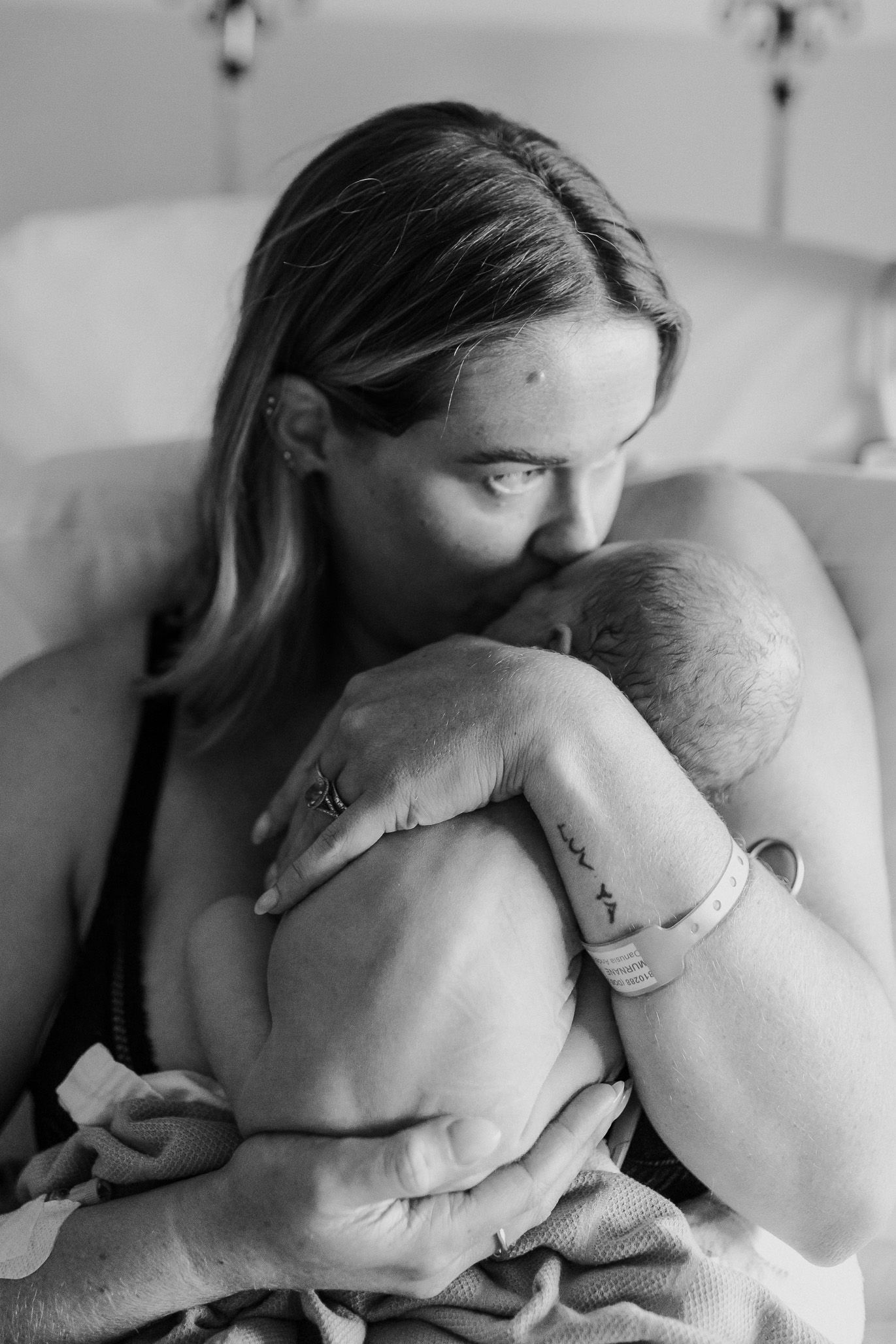 Intimate black and white photography sequence showing tender nurturing moments.