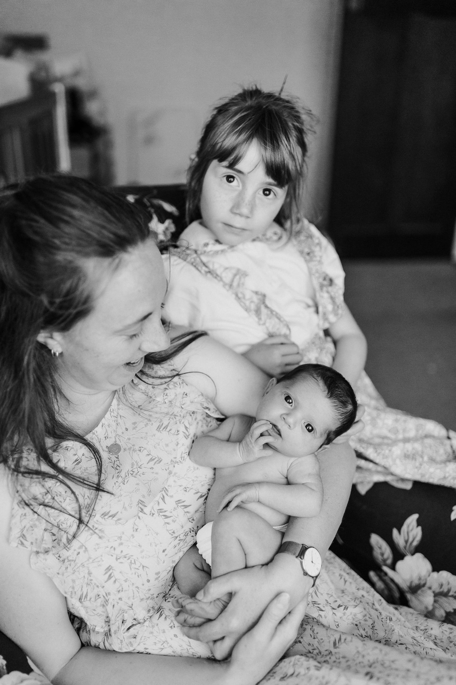 Intimate black and white portrait of tender moments shared between parent and baby.
