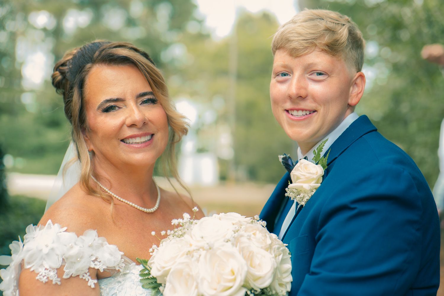Same sex smiling bride and bride sharing a romantic moment at a Georgia wedding, captured by Black Atlanta LGBTQ wedding photographer.