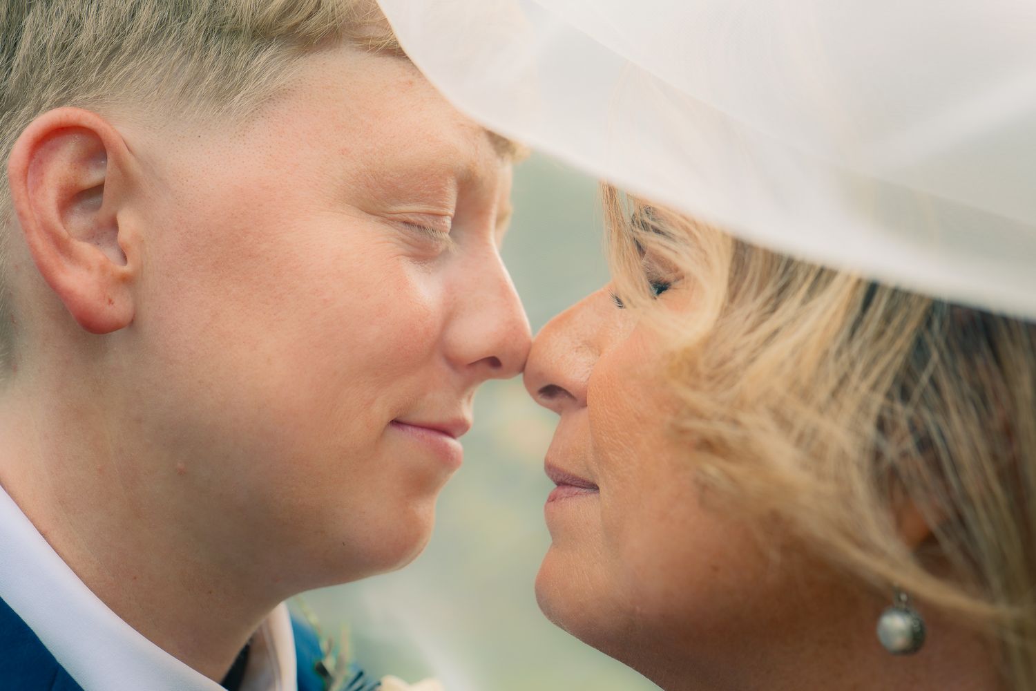 Lesbian couple sharing an intimate moment at a Georgia wedding, captured by Black Atlanta LGBTQ wedding photographer Quinton Cole Media.