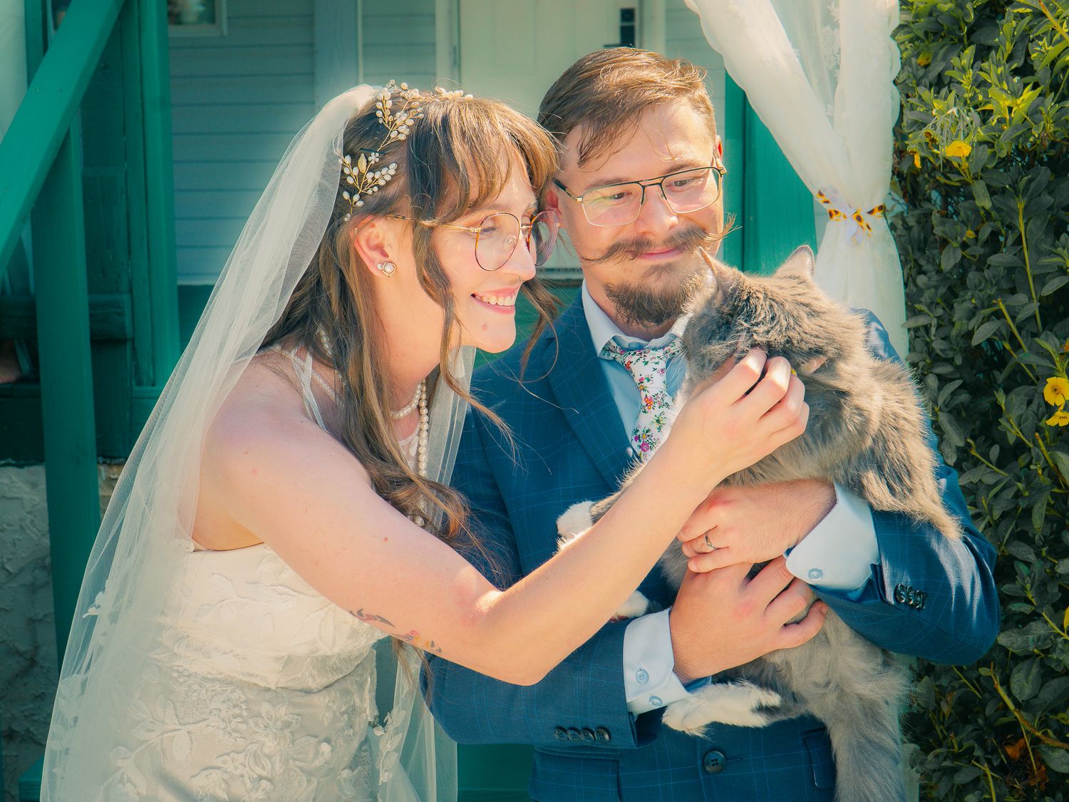 Bride and groom with the pet cat during an outdoor wedding ceremony in Georgia, captured by Snellville wedding photographer Quinton Cole