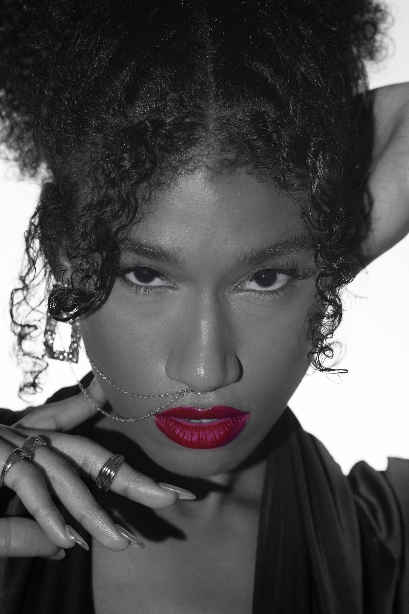 Close-up dramatic portrait highlighting creative studio lighting and high-fashion styling, produced by Quinton Cole Media in Metro Atlanta.