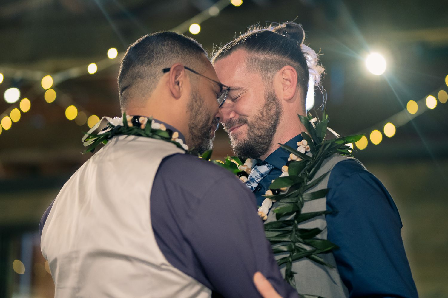 Gay couple celebrating at their Marietta Georgia wedding reception, photographed by Black Atlanta LGBTQ wedding photographer Quinton Cole.