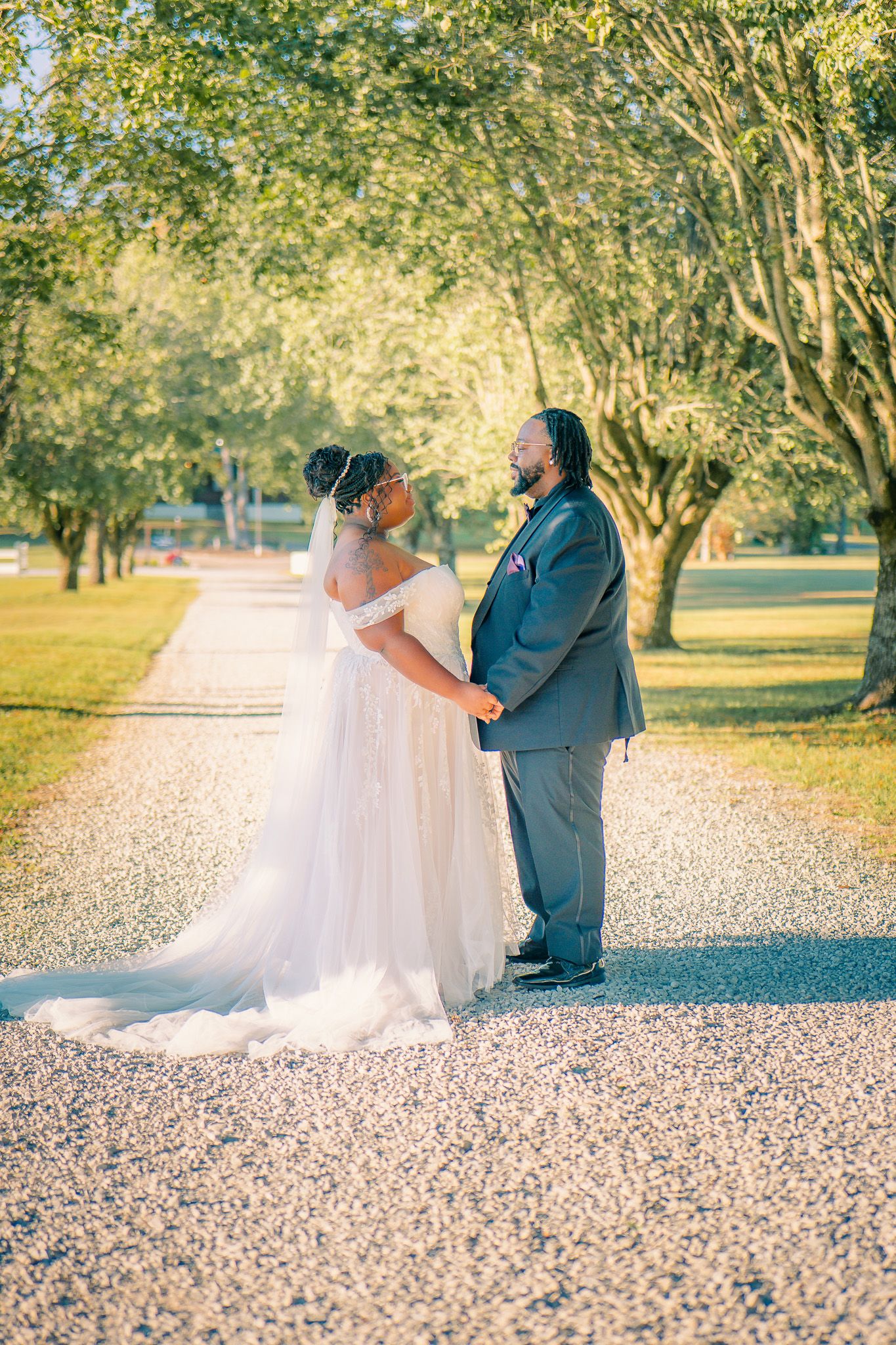 Day lit bride and groom embracing during a romantic Georgia wedding, photographed by Snellville wedding photographer Quinton Cole Media.