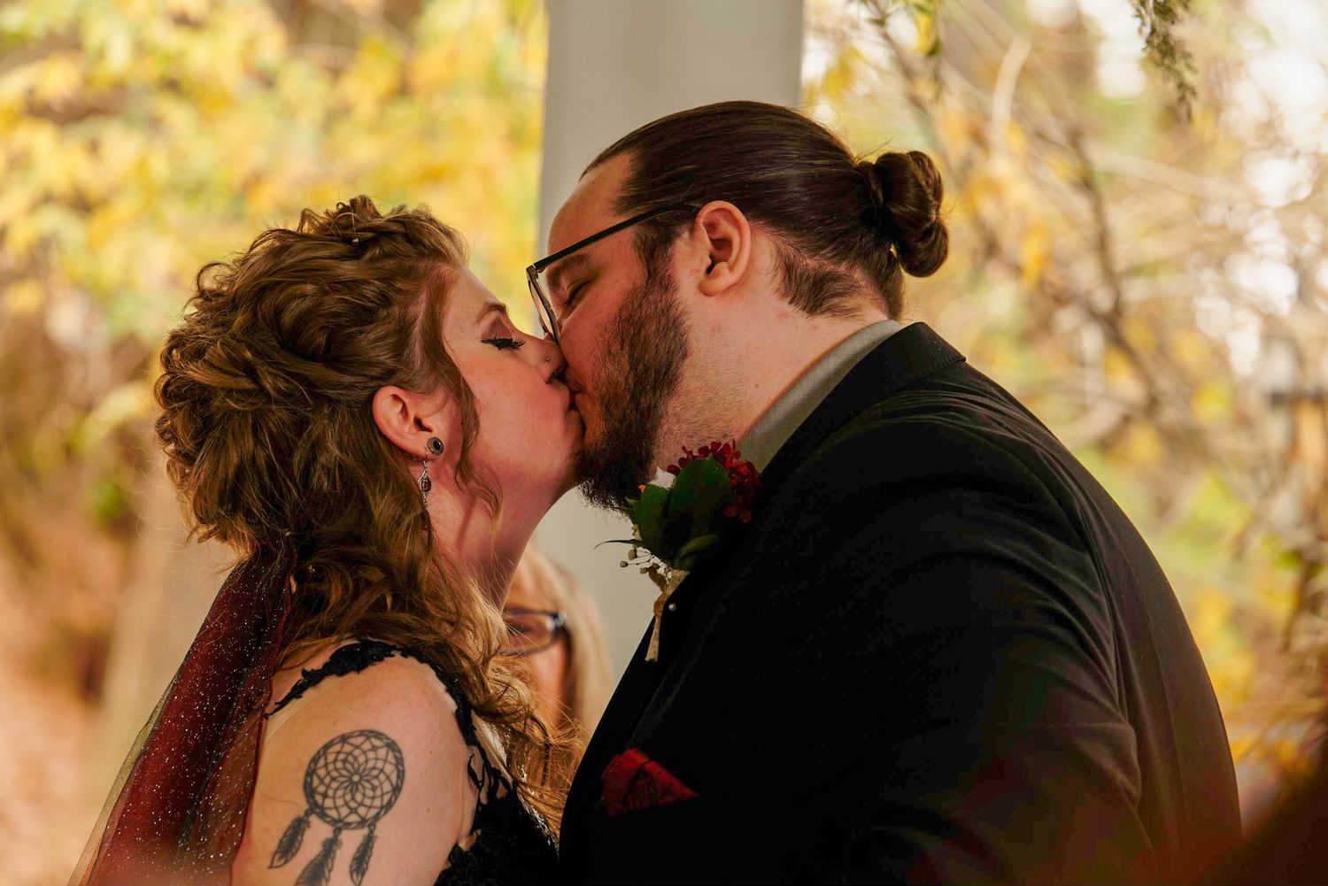Alt Couple sharing kiss at Gwinnett County Wedding captured by Black LGBTQ+ wedding photographer and videographer Quinton Cole Media