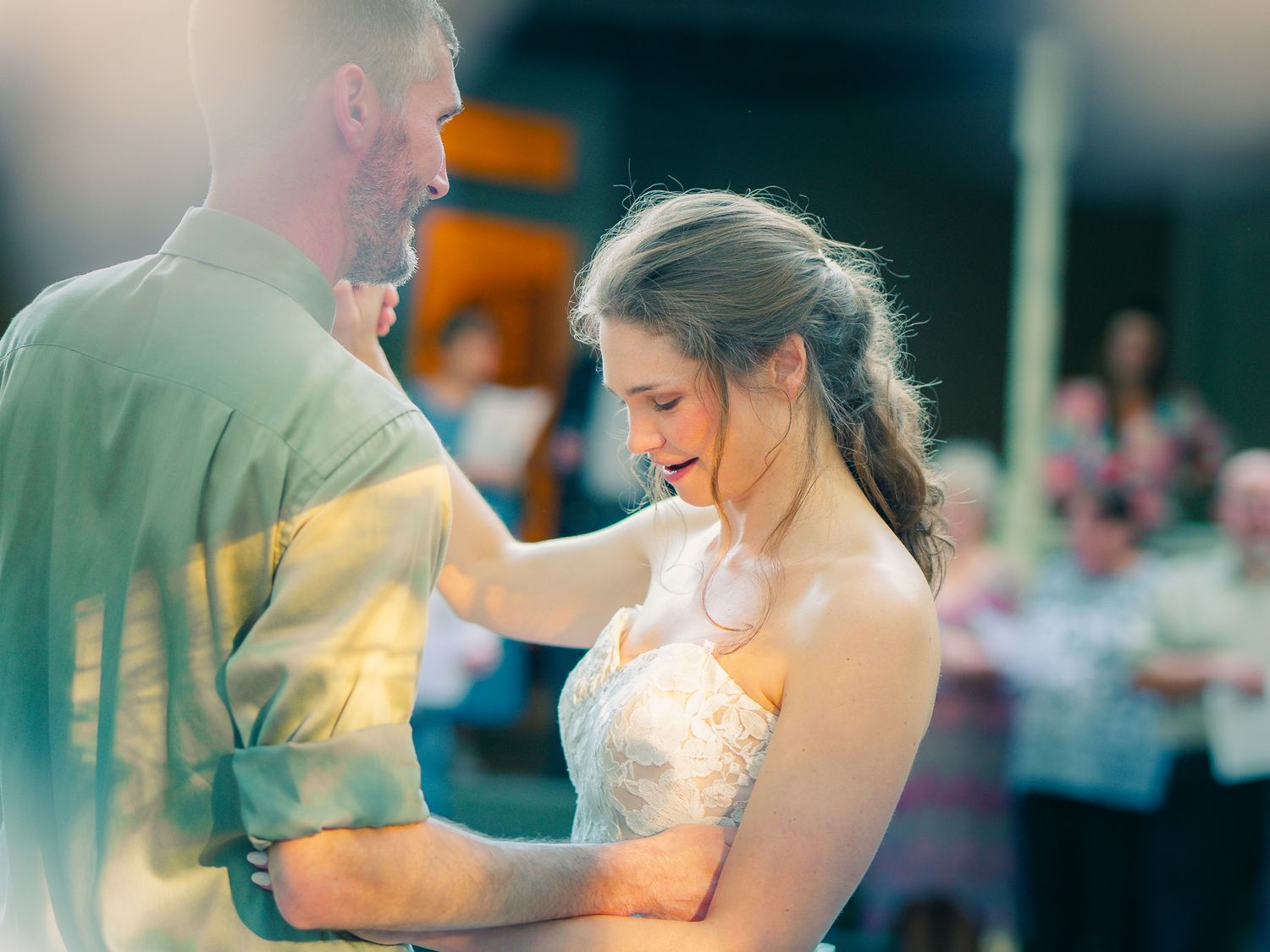 Sunlit bride and groom sharing a candid moment at a Decatur wedding, photographed by Snellville wedding photographer Quinton Cole Media.