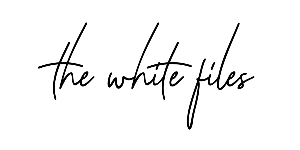 Black handwritten text reading 'the white files' on a dark background.