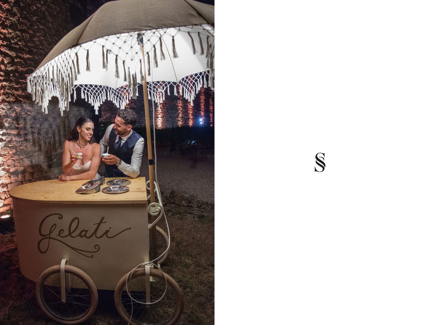 Couple sharing a romantic moment at a Gelato cart under a decorative umbrella at an outdoor evening wedding reception.