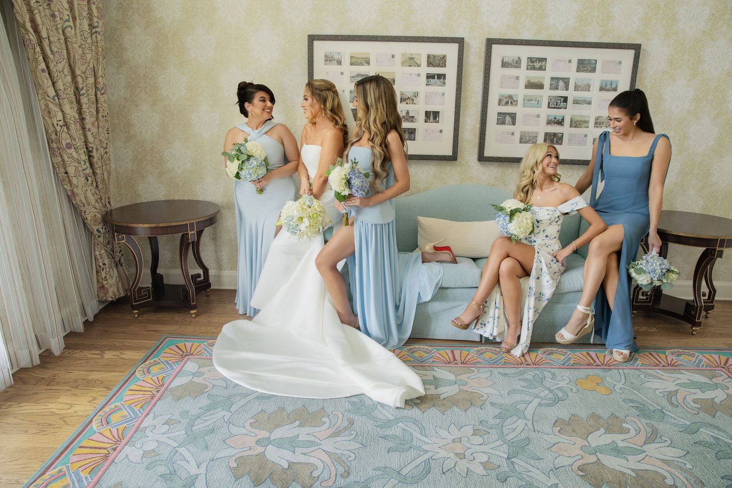 Wedding preparation scene with bridesmaids in light blue dresses helping with the final touches.