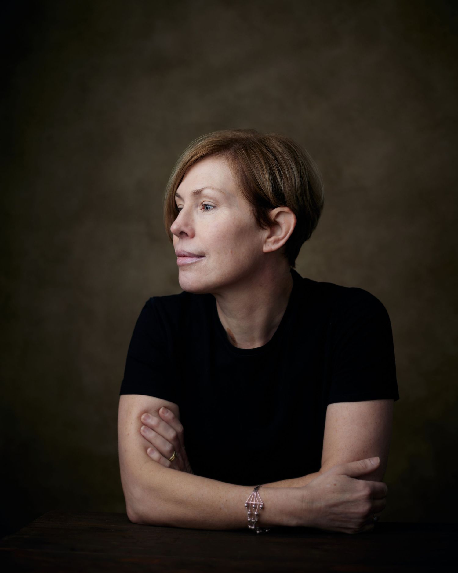 Geraint Todd creative headshot; woman looking off-camera with a unique, stylish presence in the studio.