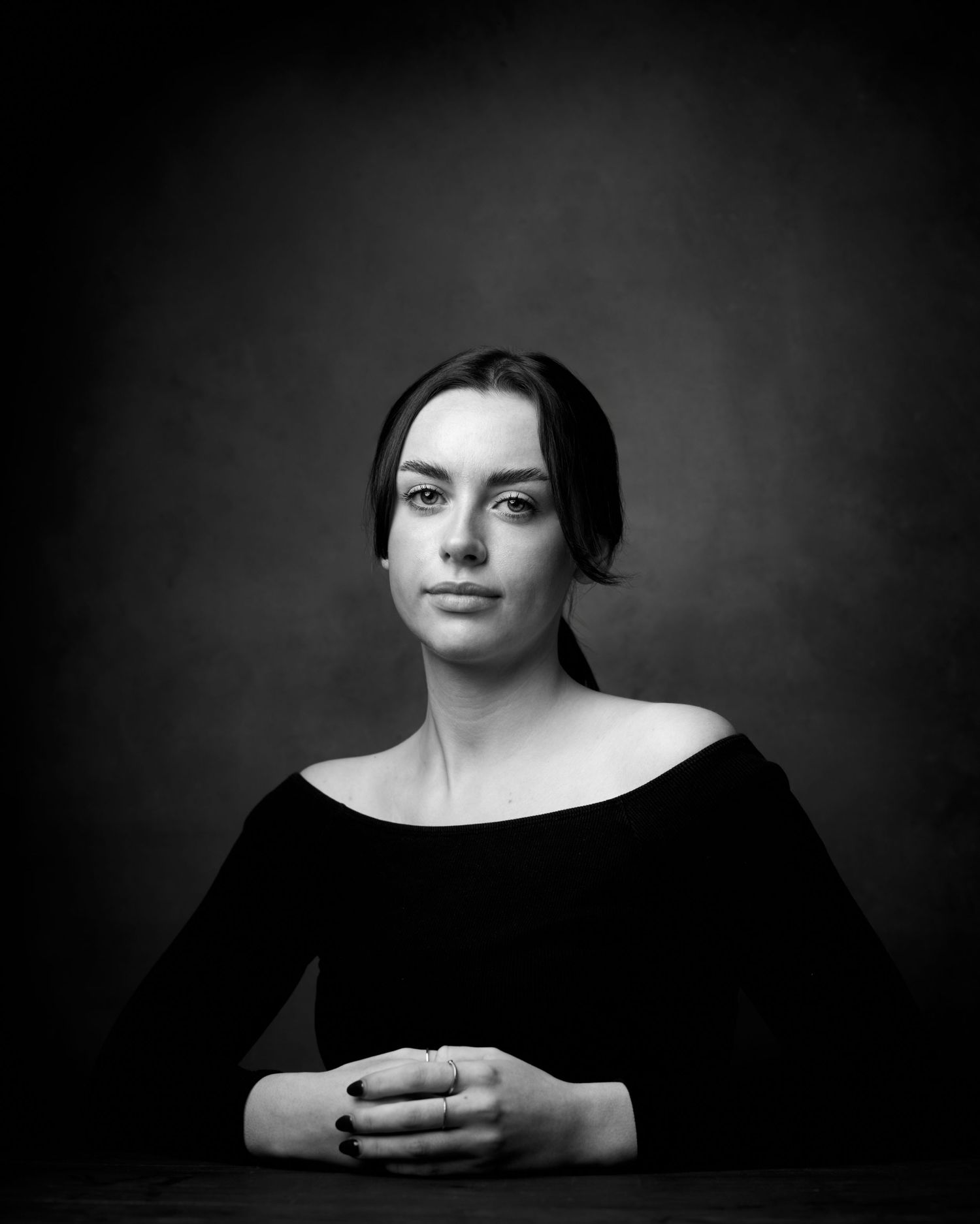 Black and white headshot of an actress in a timely period pose in a studio setting.