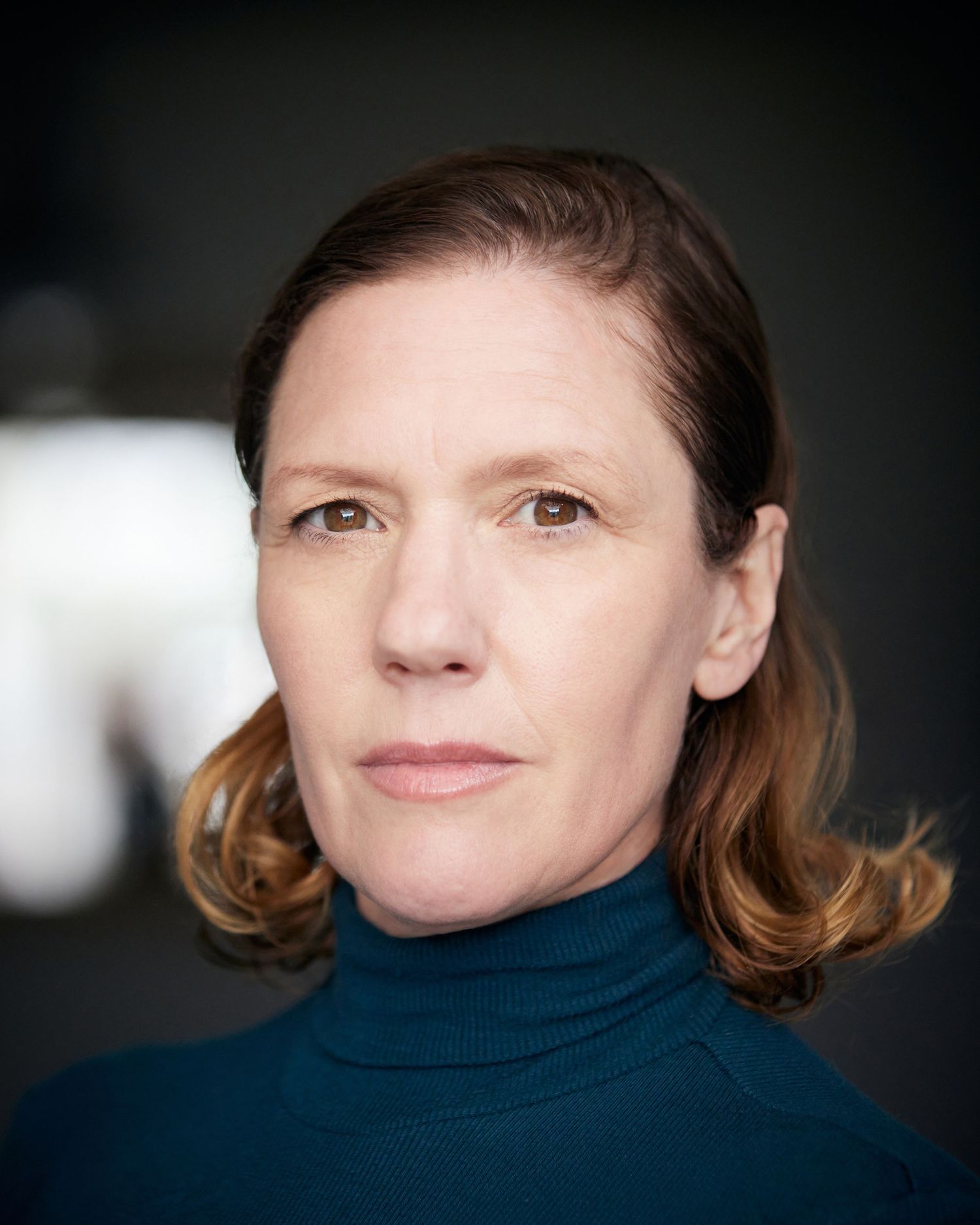 Cardiff outdoor headshot; period energy with creamy organic bokeh.
