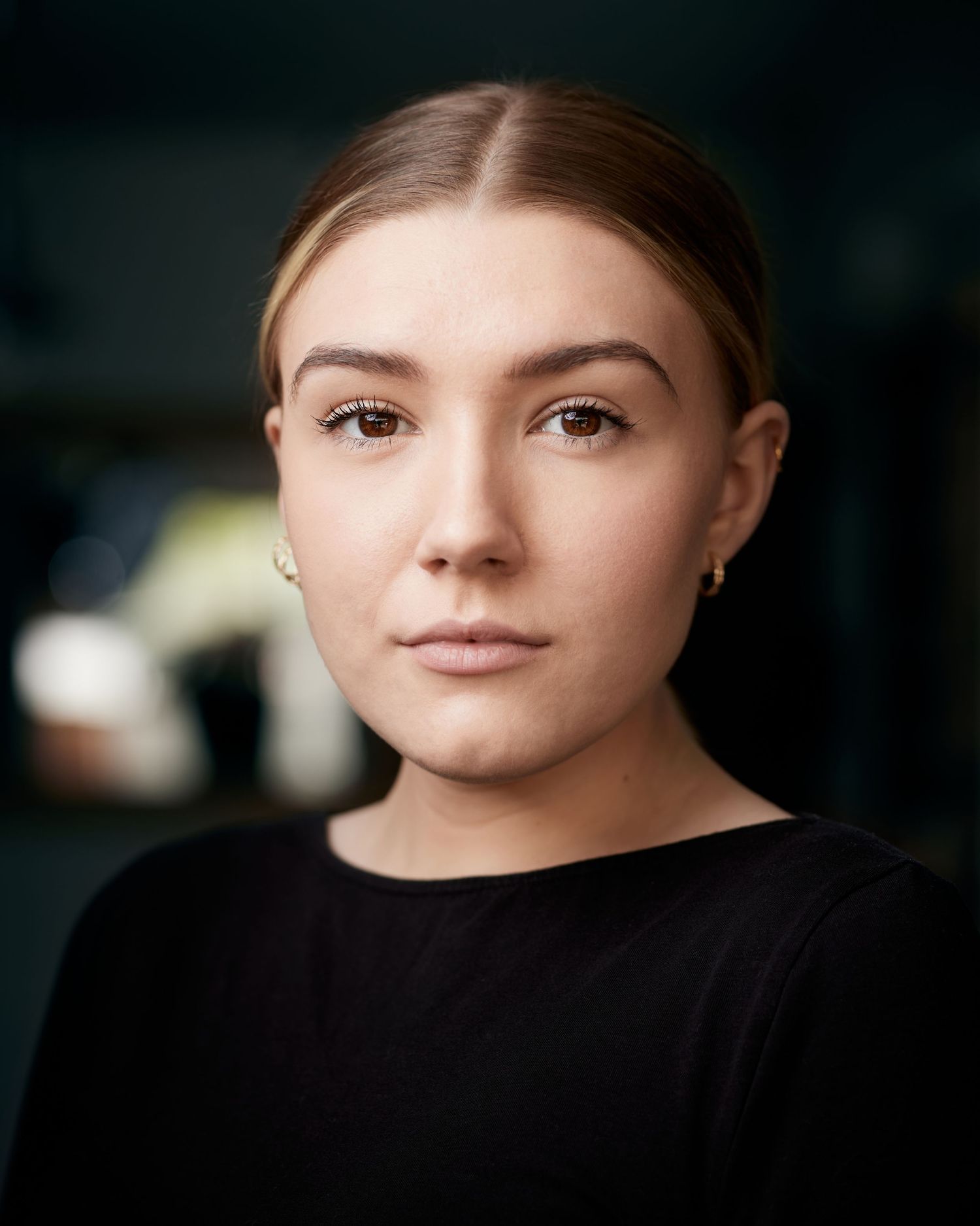 Stylish actor headshot; edgy presence in Cardiff natural daylight.