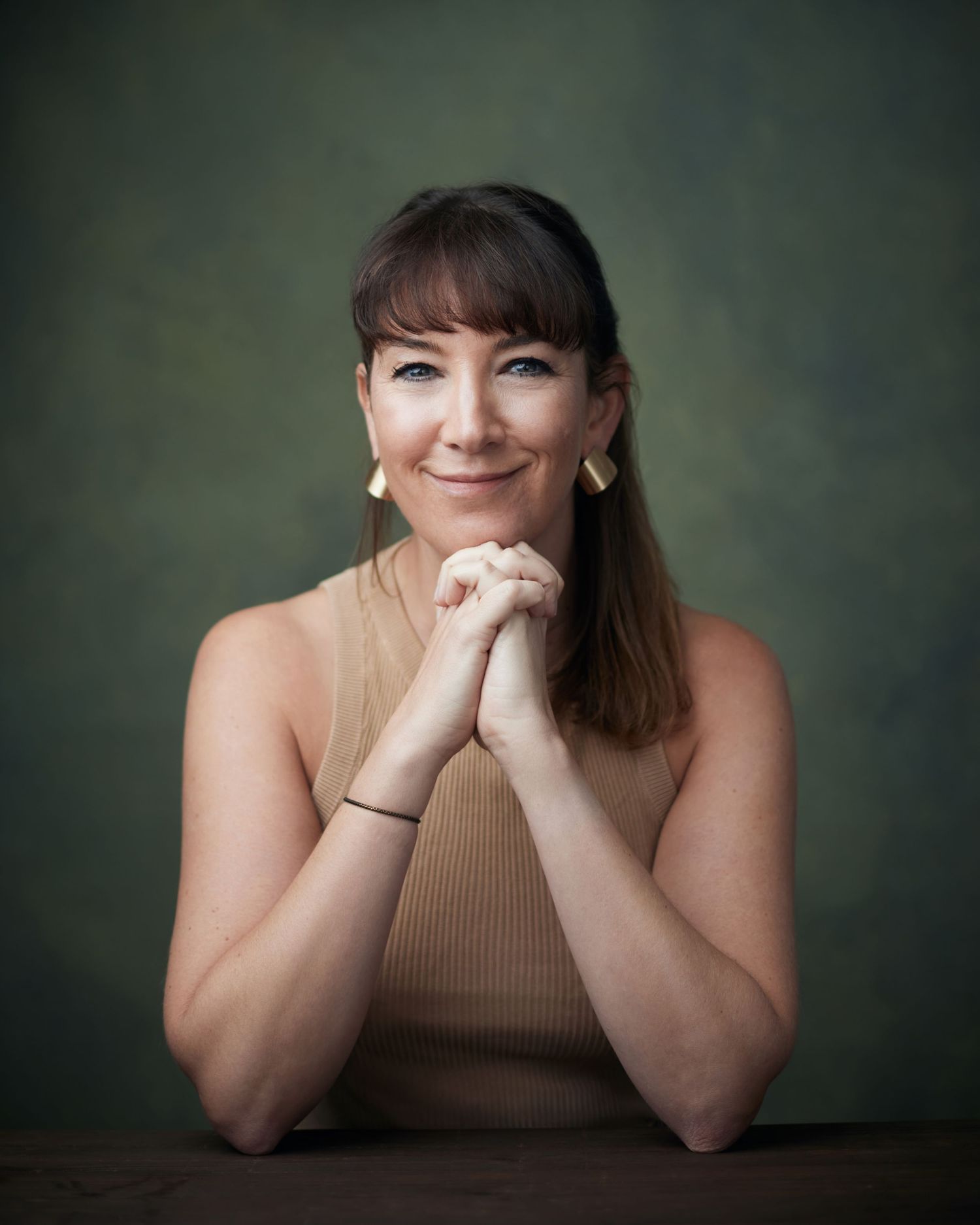 Vibrant business portrait; business woman with a bright, energetic look in Cardiff.