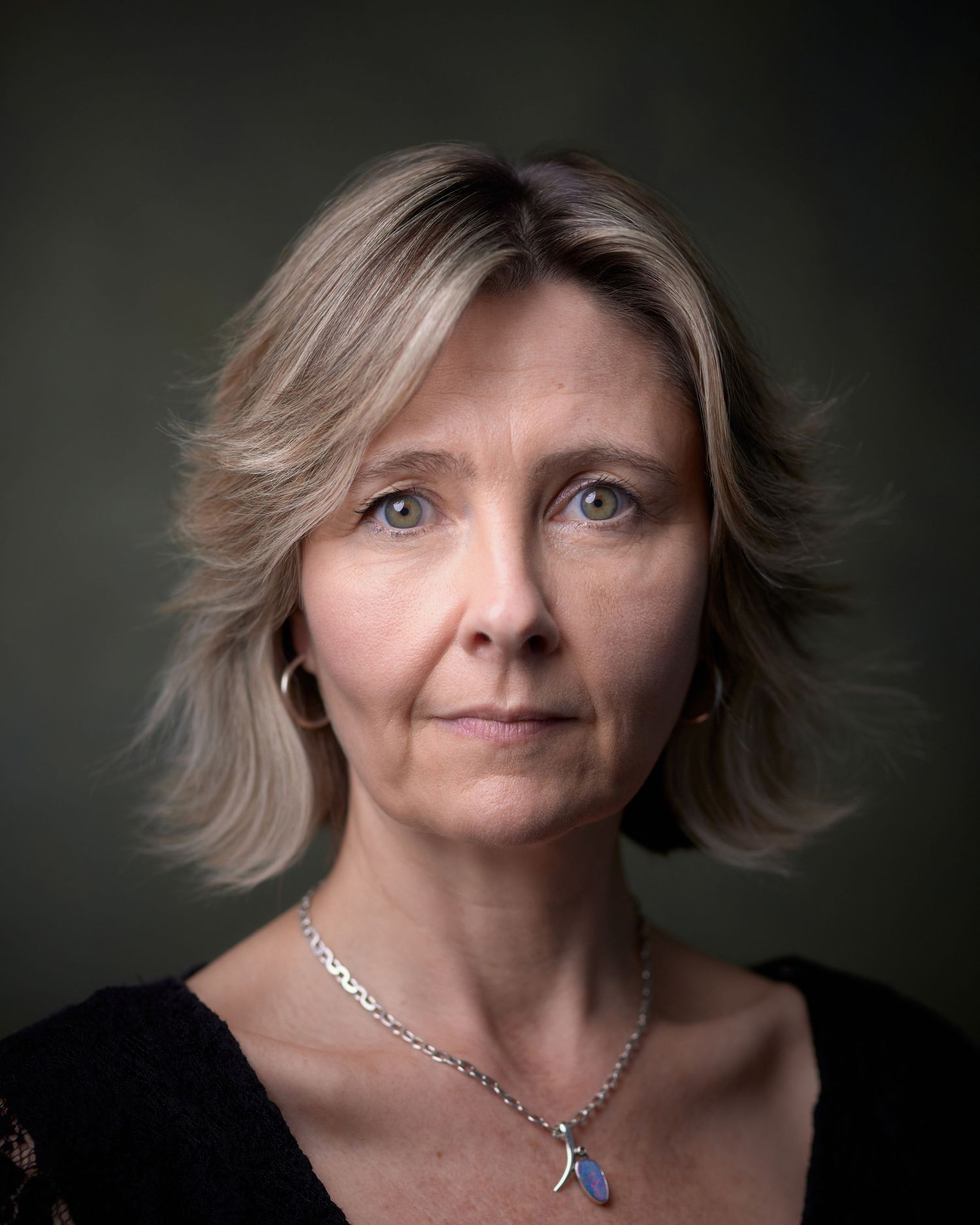 Dramatic, high-contrast actor headshot of Noni Lewis. Cinematic lighting for detective or antagonist casting roles in South Wales.