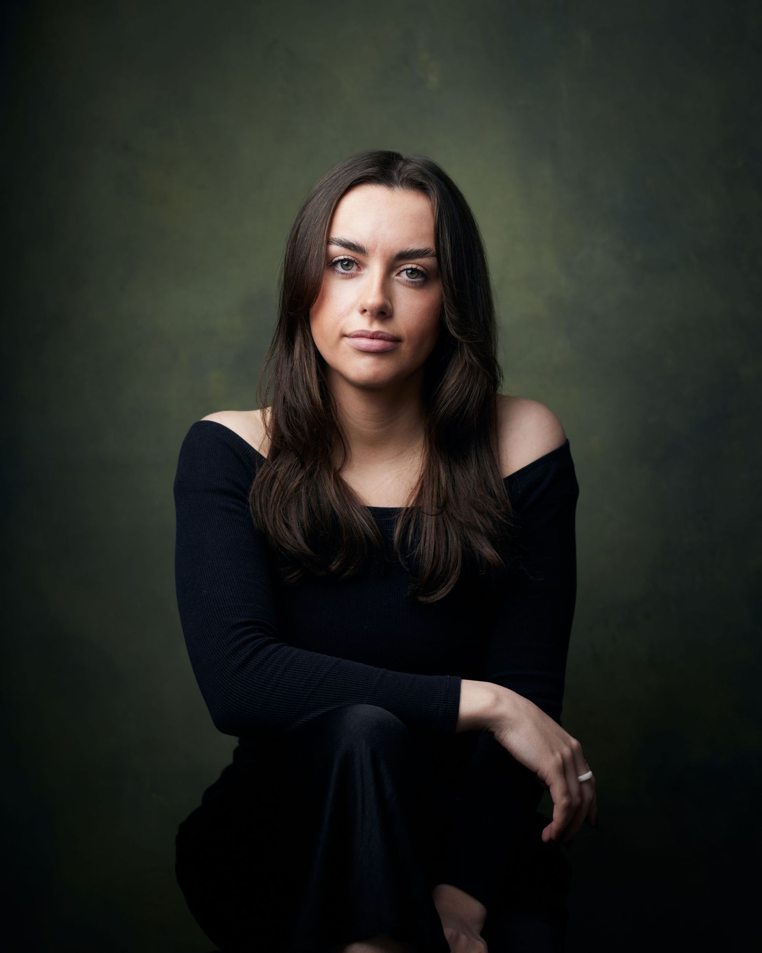 Strong character actor portrait; woman with a stern, authoritative presence in the studio.