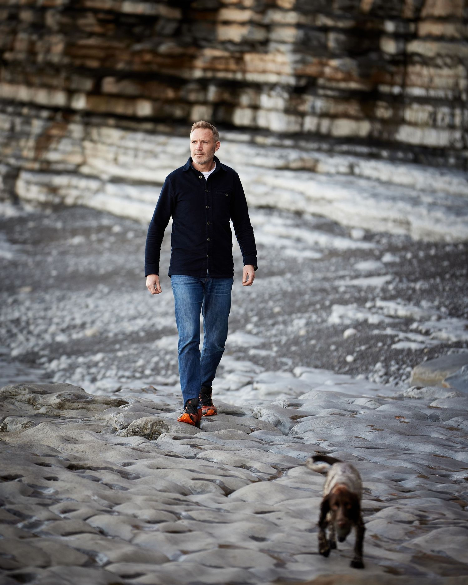 Environmental portrait of a man and his dog at Monk Nash, South Wales