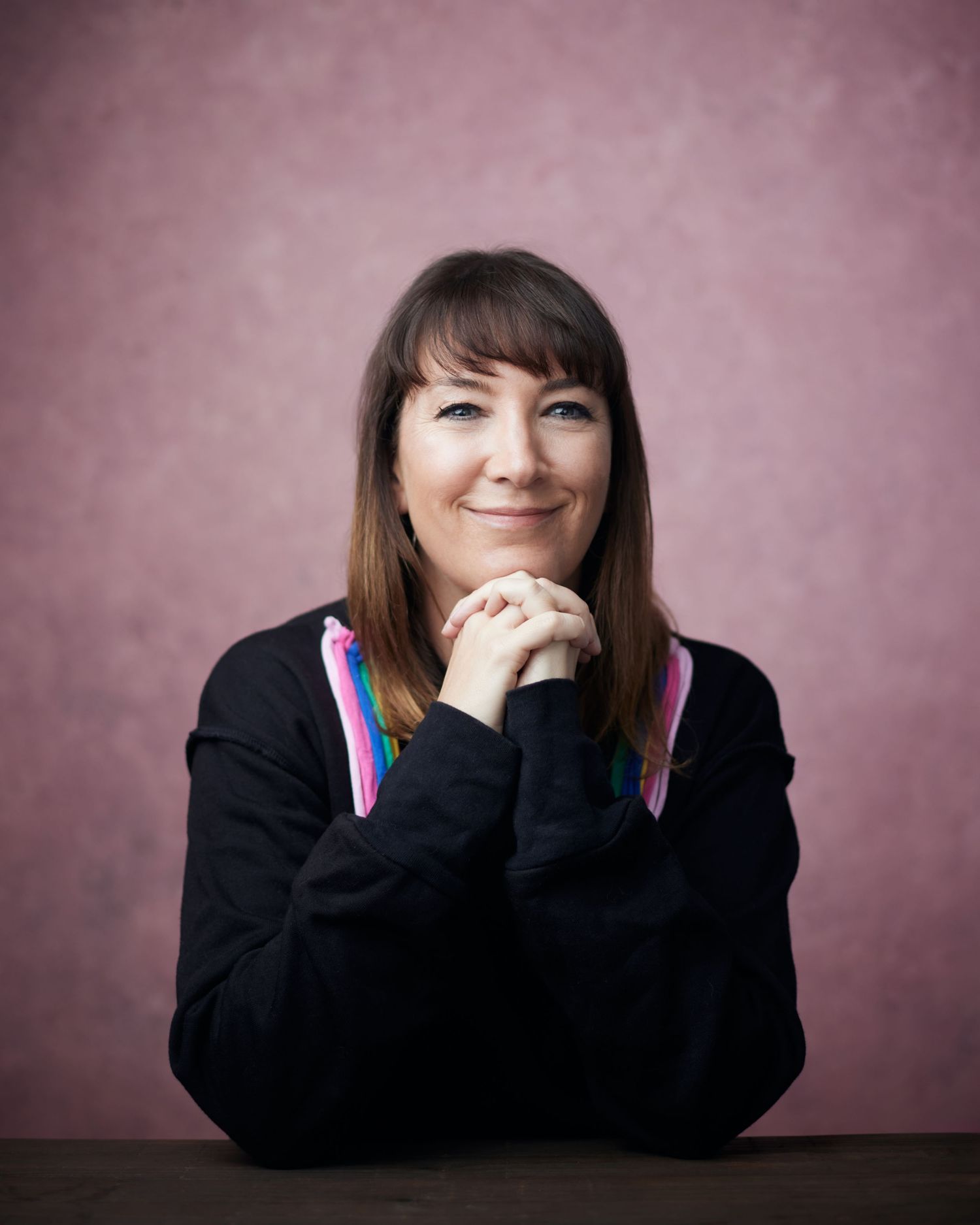 Friendly business portrait; business woman with a soft, inquisitive look in Cardiff.