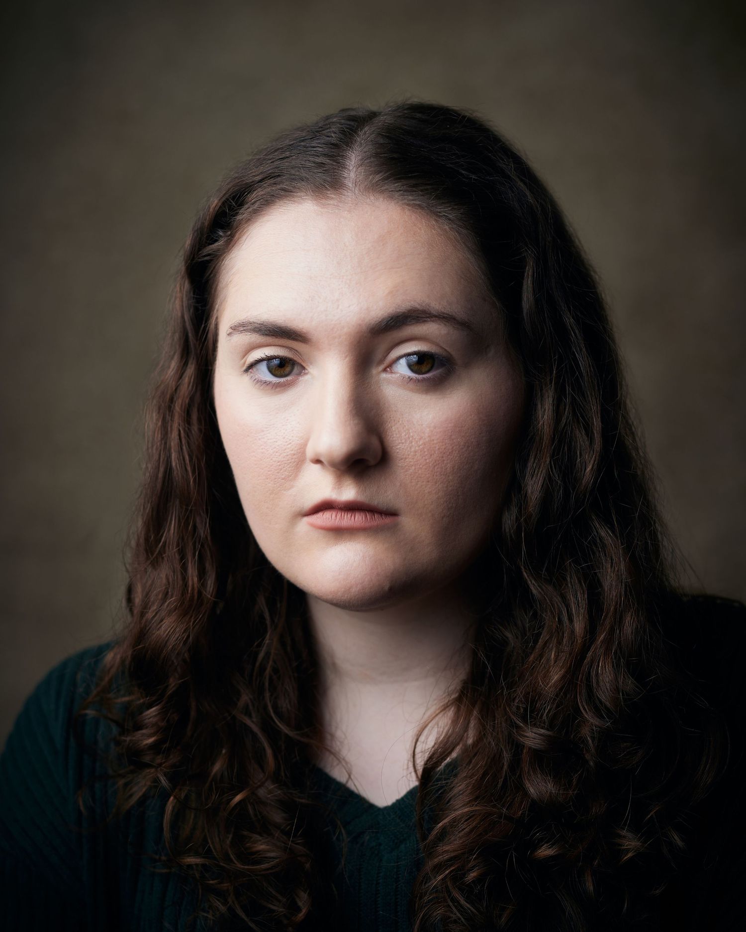 Modern studio portrait; female actor with a rebellious, defiant look and sharp lighting.