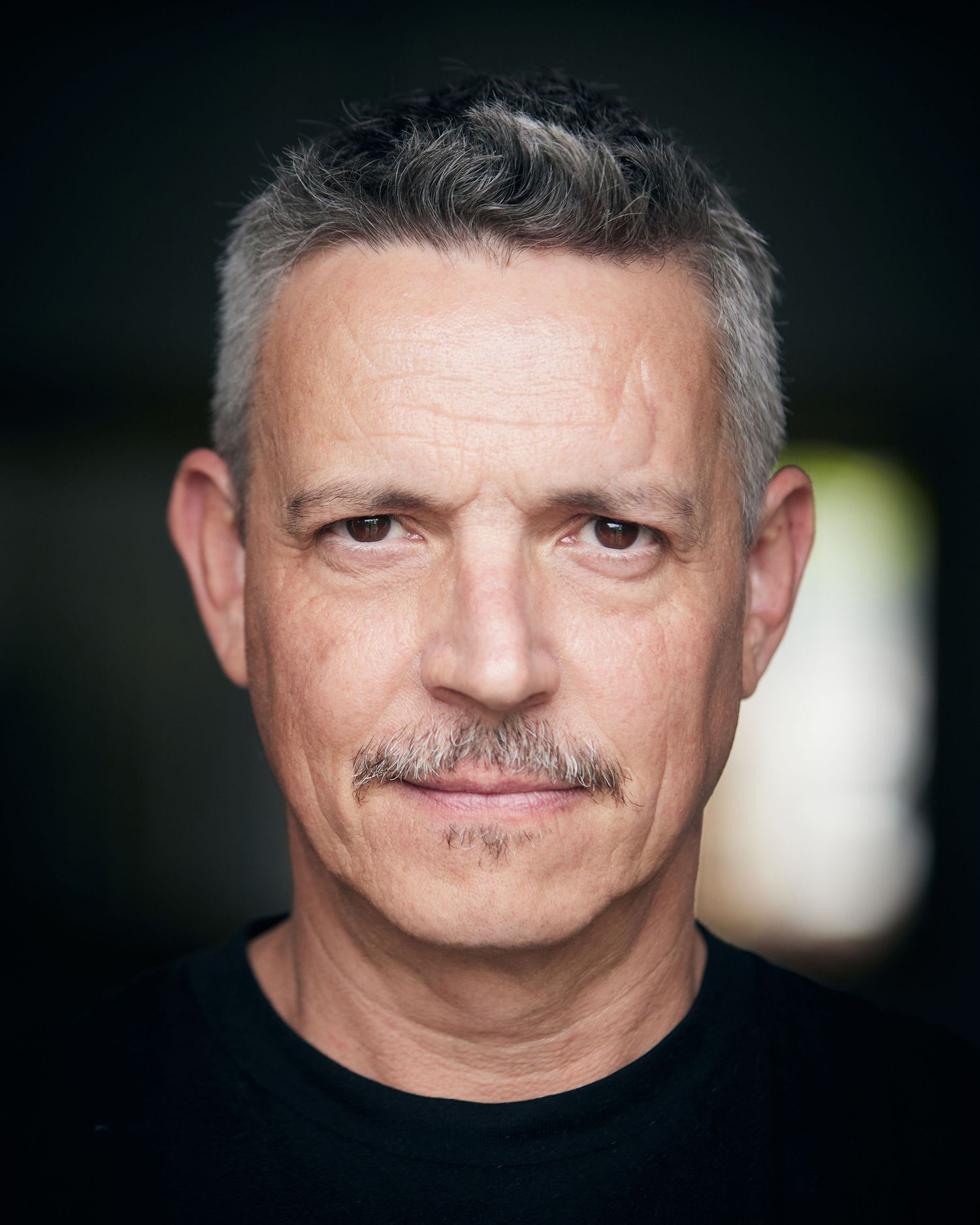 Expertly directed strong male headshot by Cardiff photographer Geraint Todd.