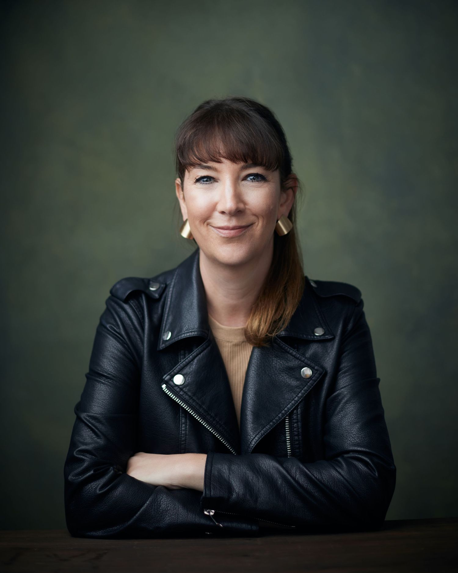 Approachable executive headshot; professional with a warm and capable presence in Cardiff.