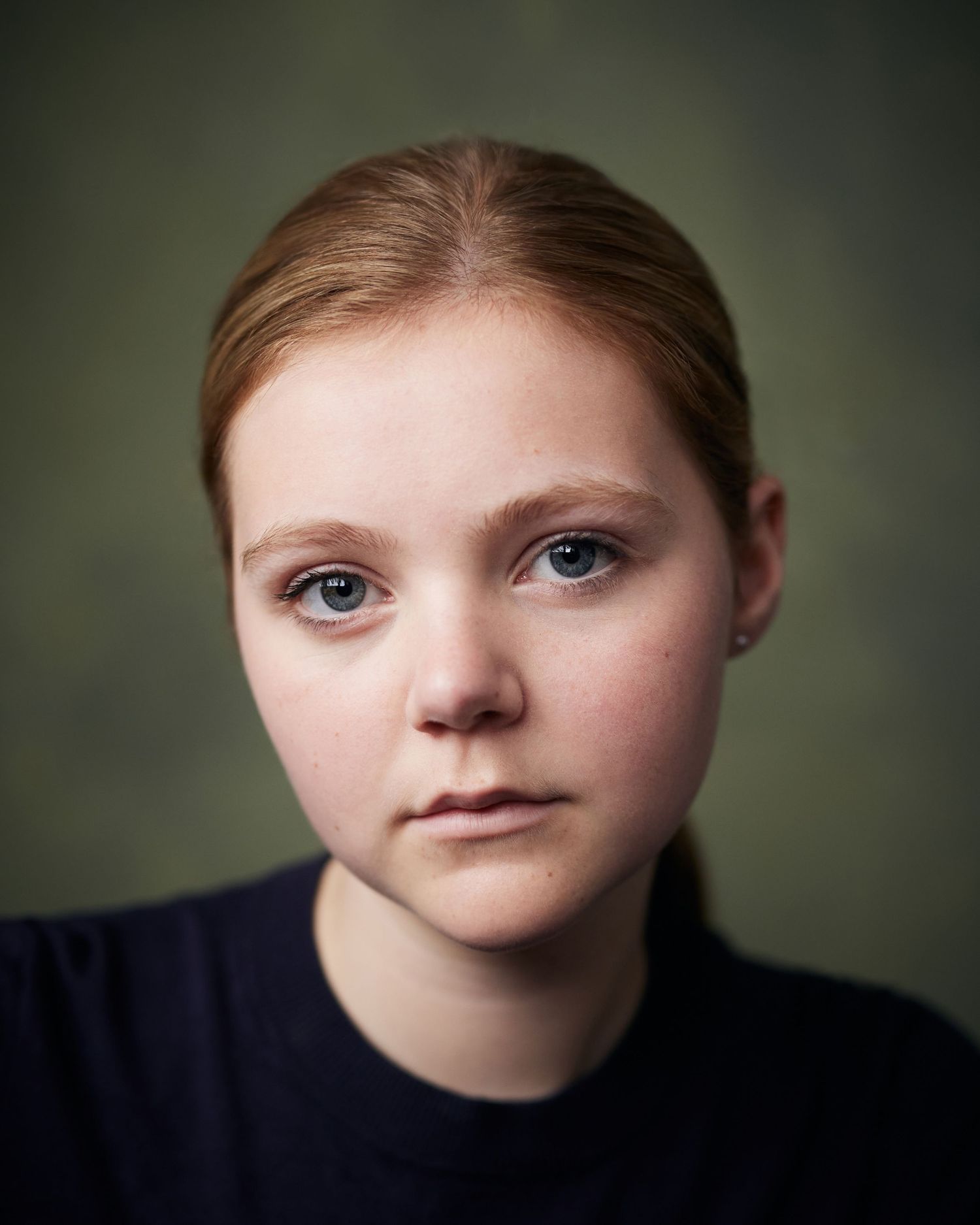 Character-driven actor headshot showing versatile range.