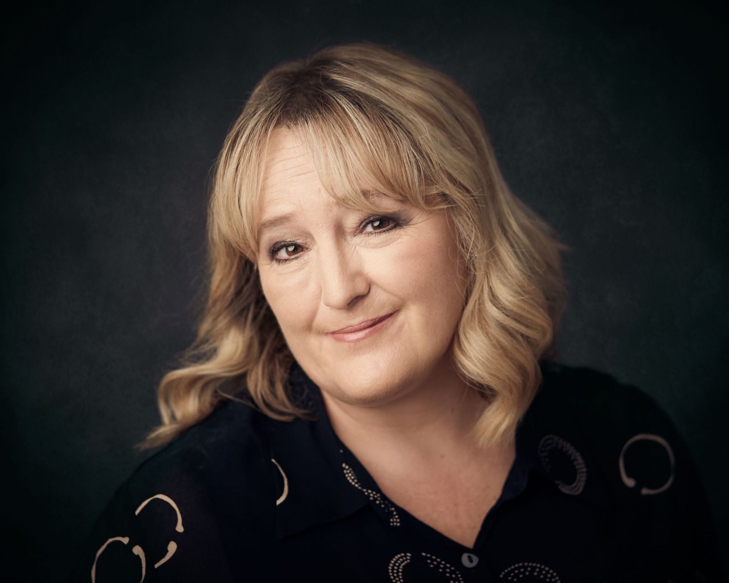 Warm and approachable female actor headshot taken in my Cardiff studio.
