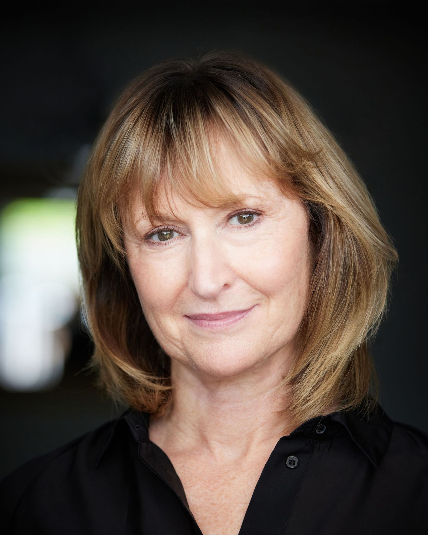 Approachable commercial headshot for a female performer in South Wales.