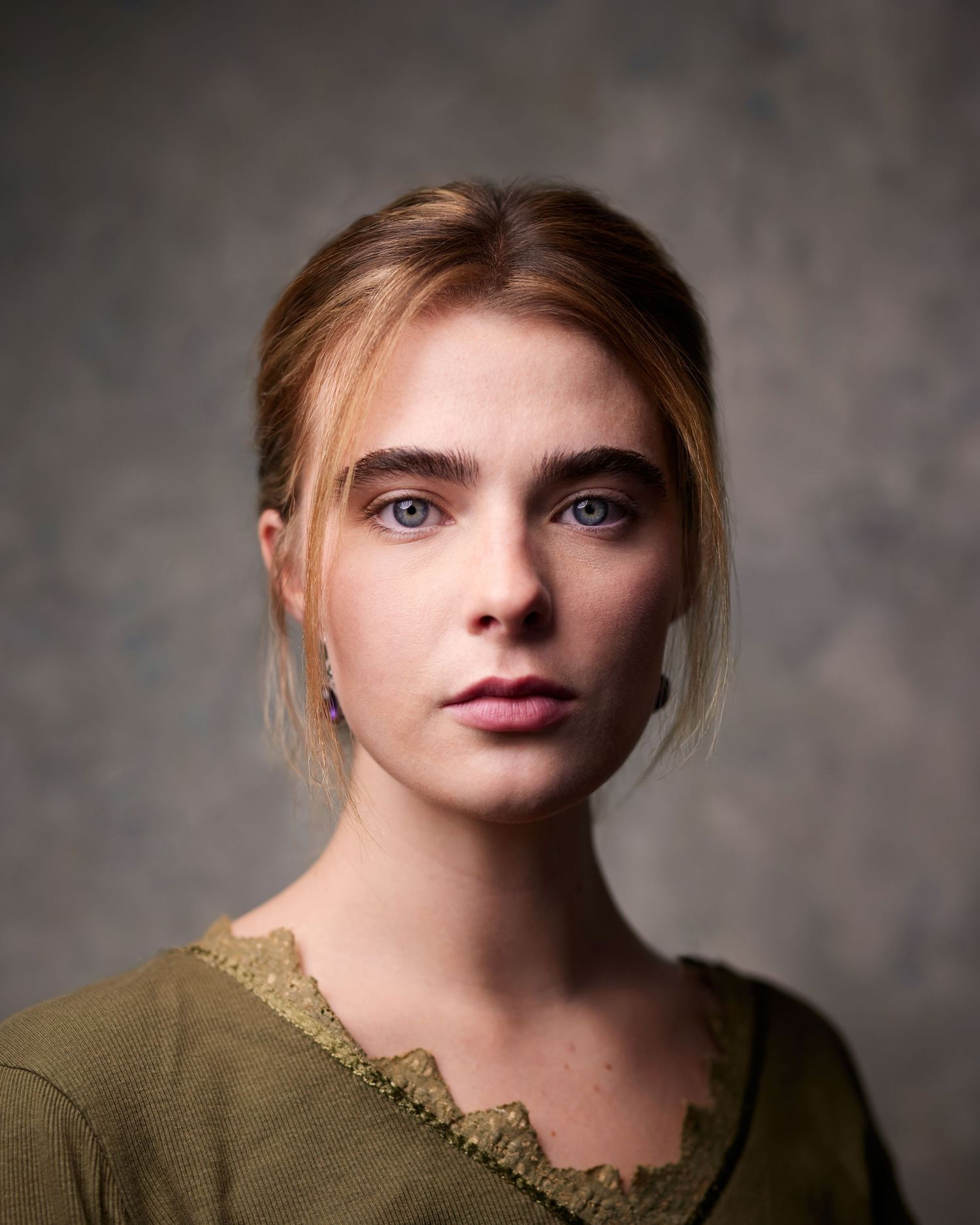 Neutral mottled grey hand-painted backdrop for an artistic period headshot by Geraint Todd.