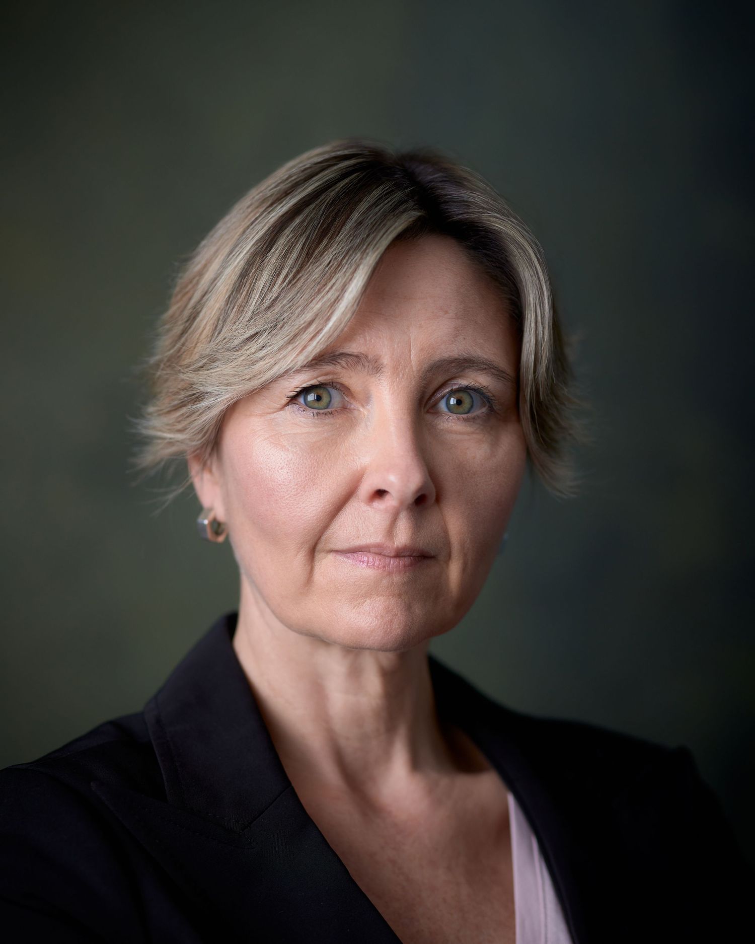 Professional headshot of Noni Lewis in a black blazer. High-status casting look for lawyer or surgeon roles, photographed in Cardiff.
