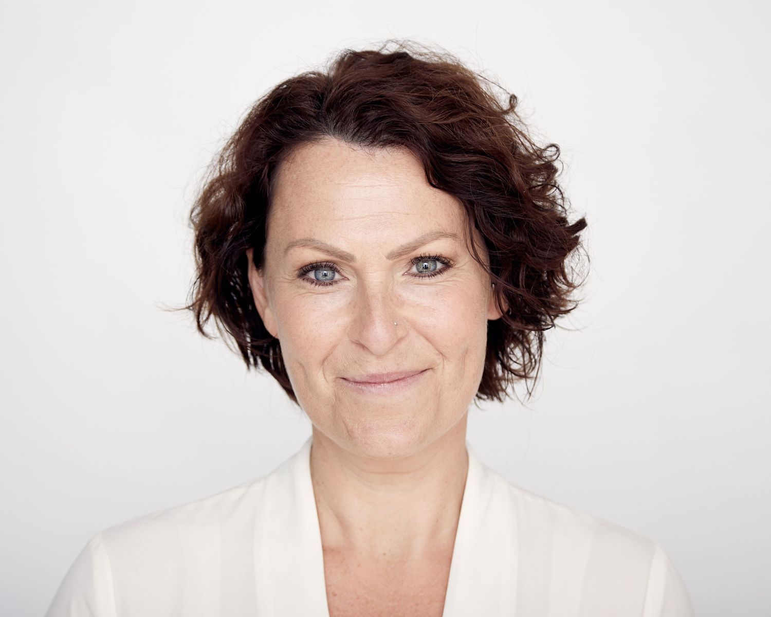 Casting-focused actor headshot with a clean, neutral background.