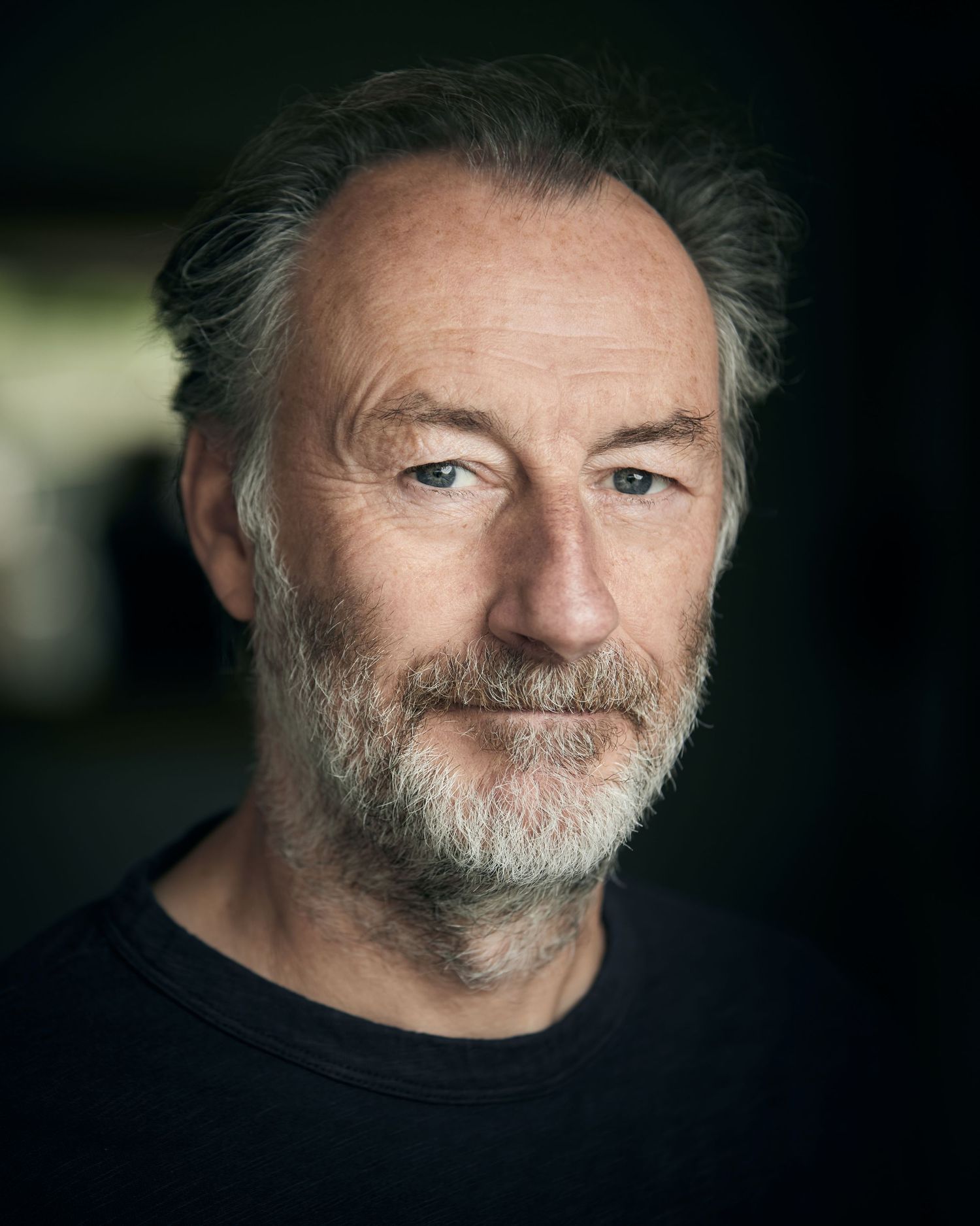 Cardiff outdoor headshot; confident gaze in soft natural light.