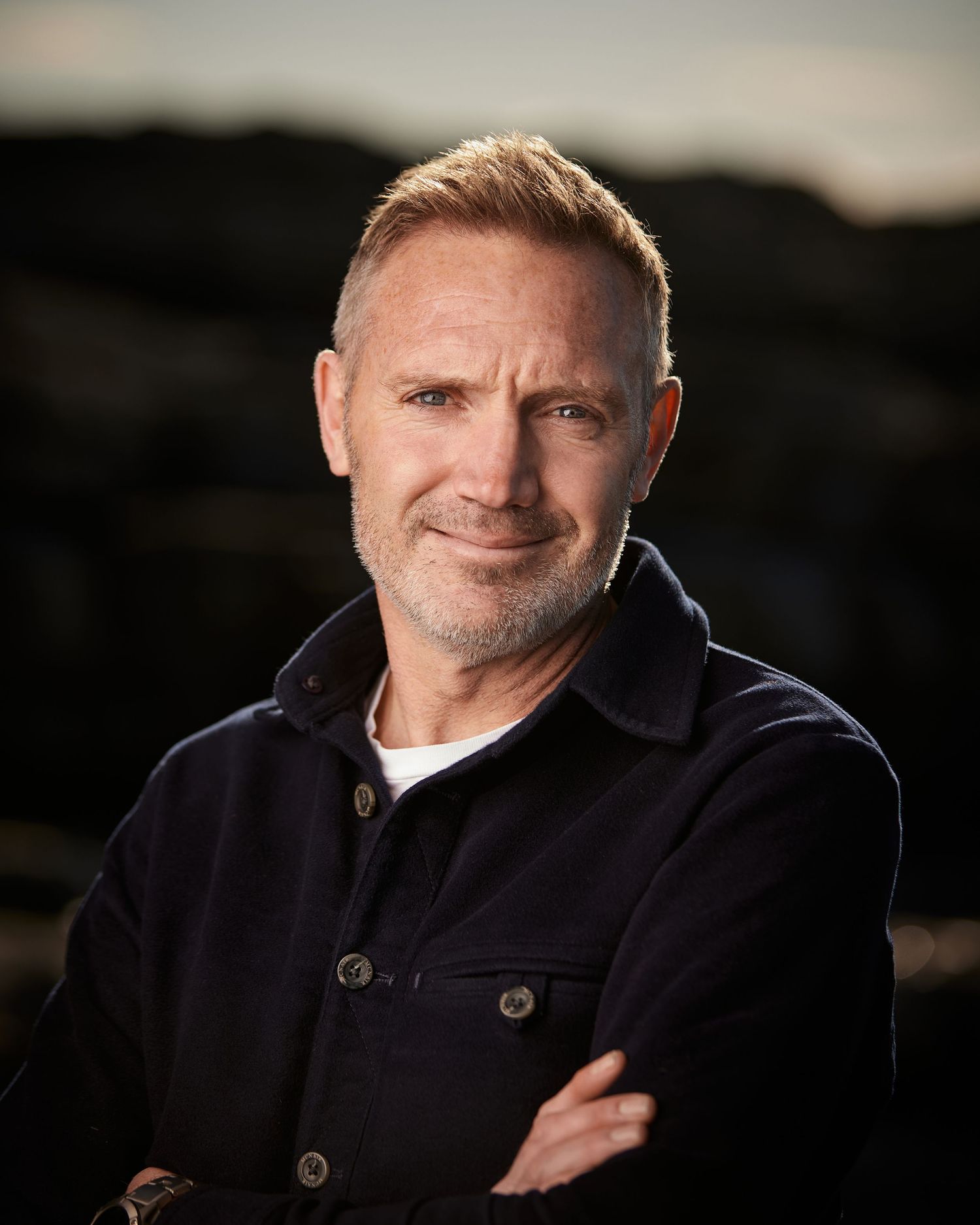 Approachable executive headshot; professional with a warm and capable presence in Cardiff.