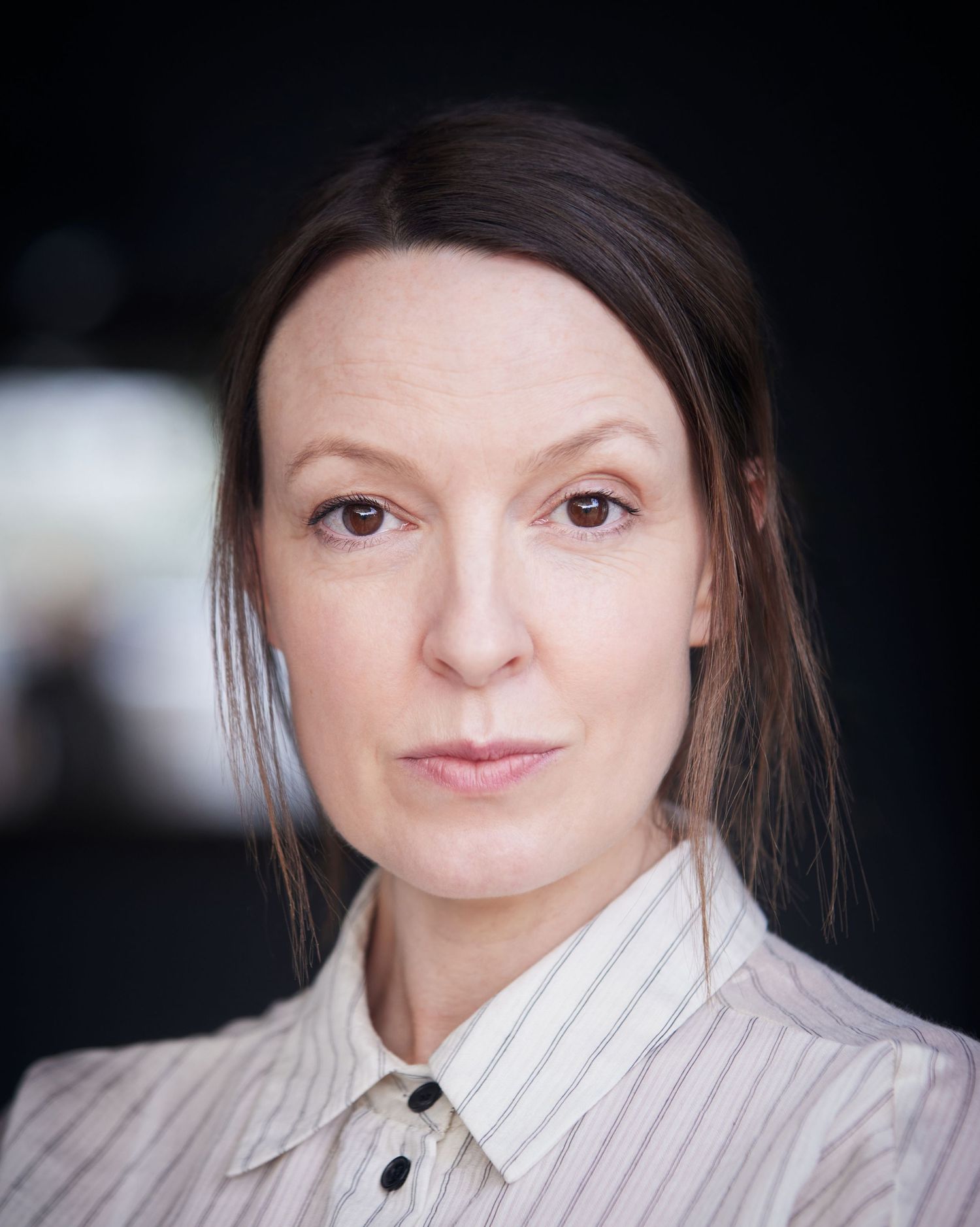 Cardiff outdoor headshot; actress with edgy energy and creamy organic bokeh.