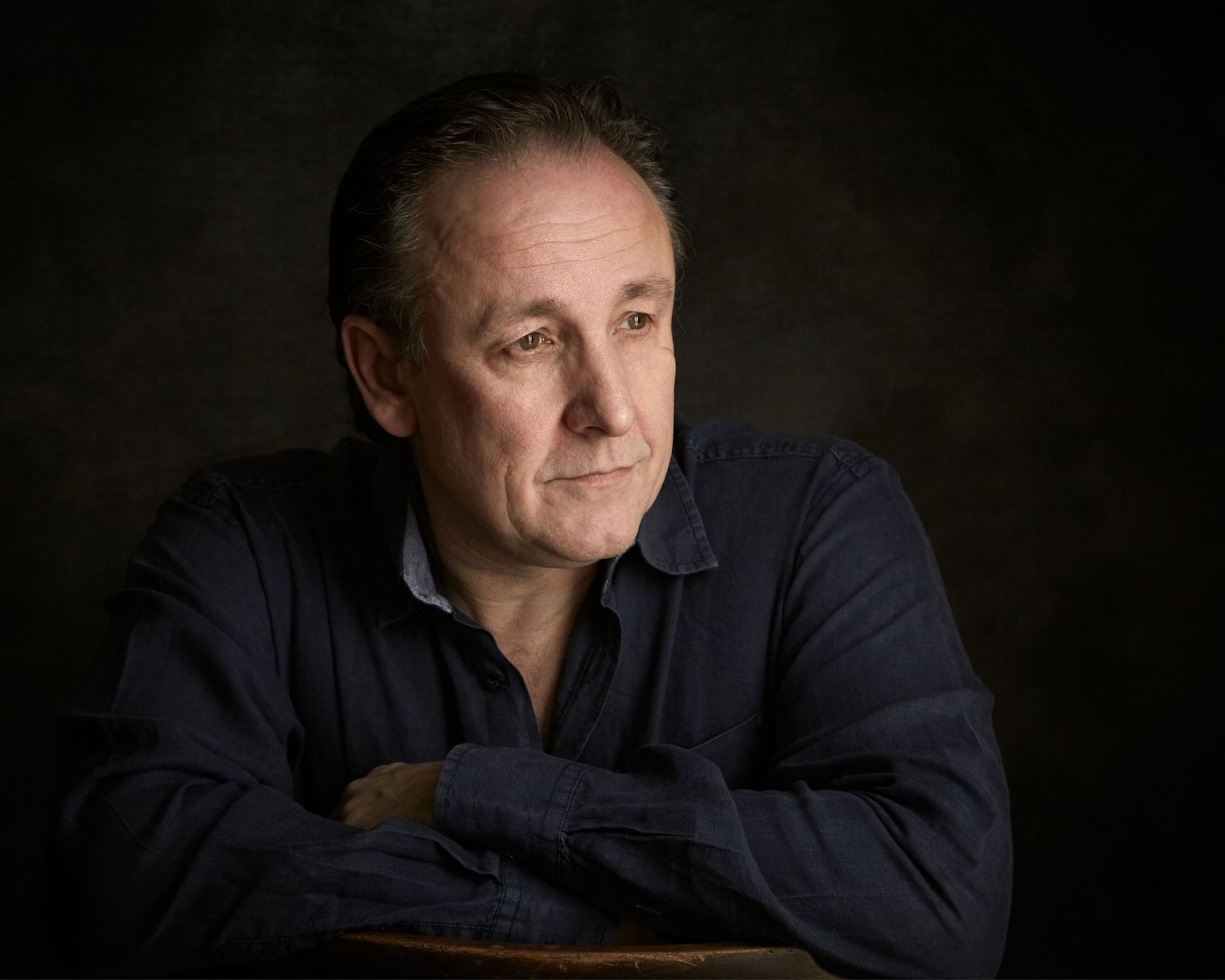 Cinematic actor headshot with dramatic studio lighting by Geraint Todd Cardiff.