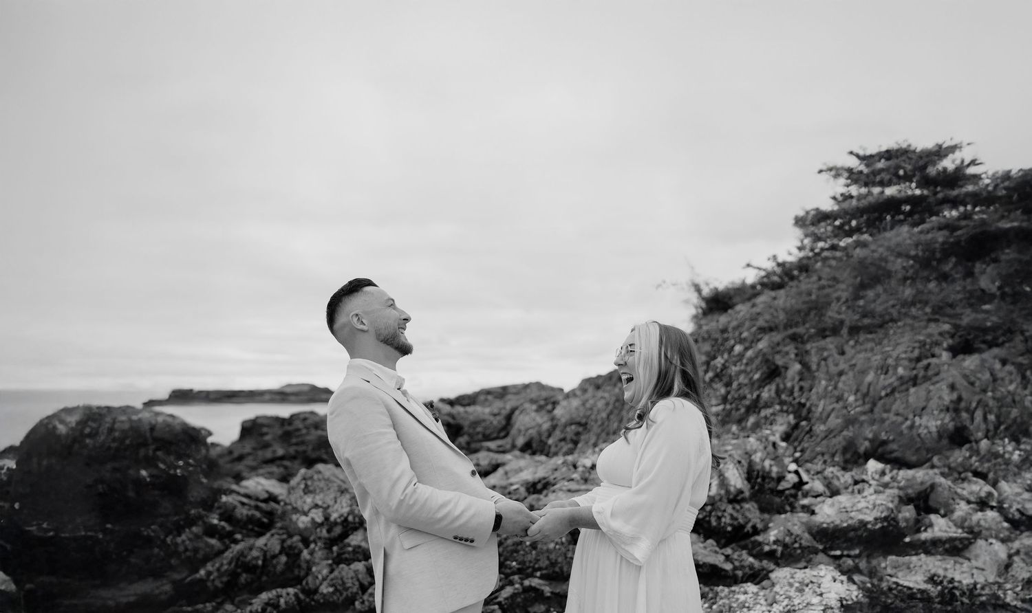 Black and white coastal photography with dramatic rocky landscape.