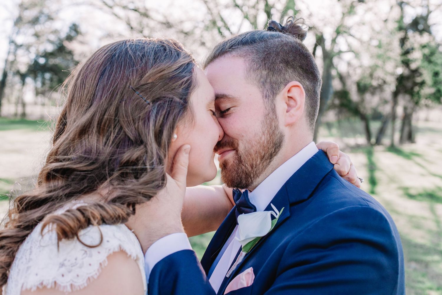 A couple shares intimate kisses in a series of romantic outdoor wedding photos wearing formal attire.