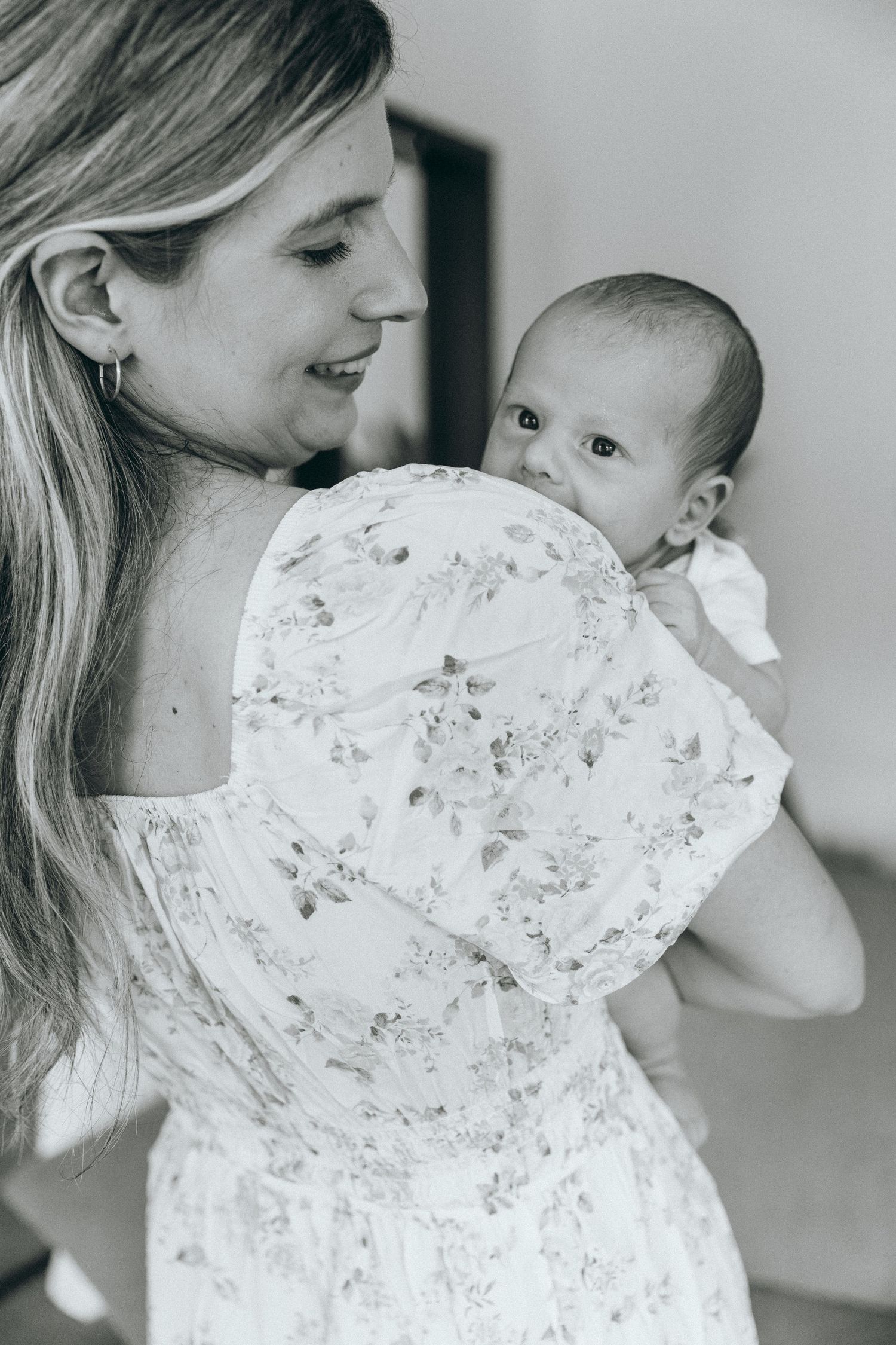 Black and white intimate portrait showing tender moments in soft lighting.