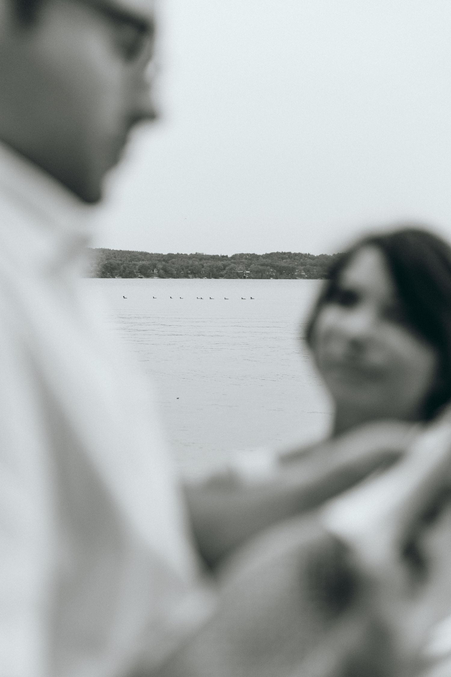 Black and white artistic close-up photos showing intimate romantic moments.