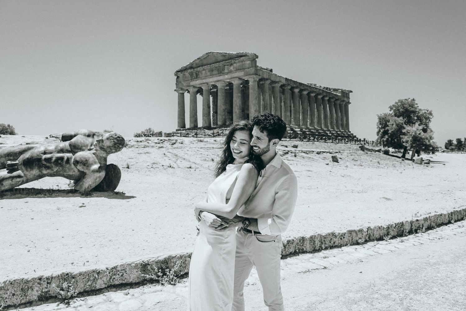 A couple shares intimate dance moves near historic Greek temple ruins.