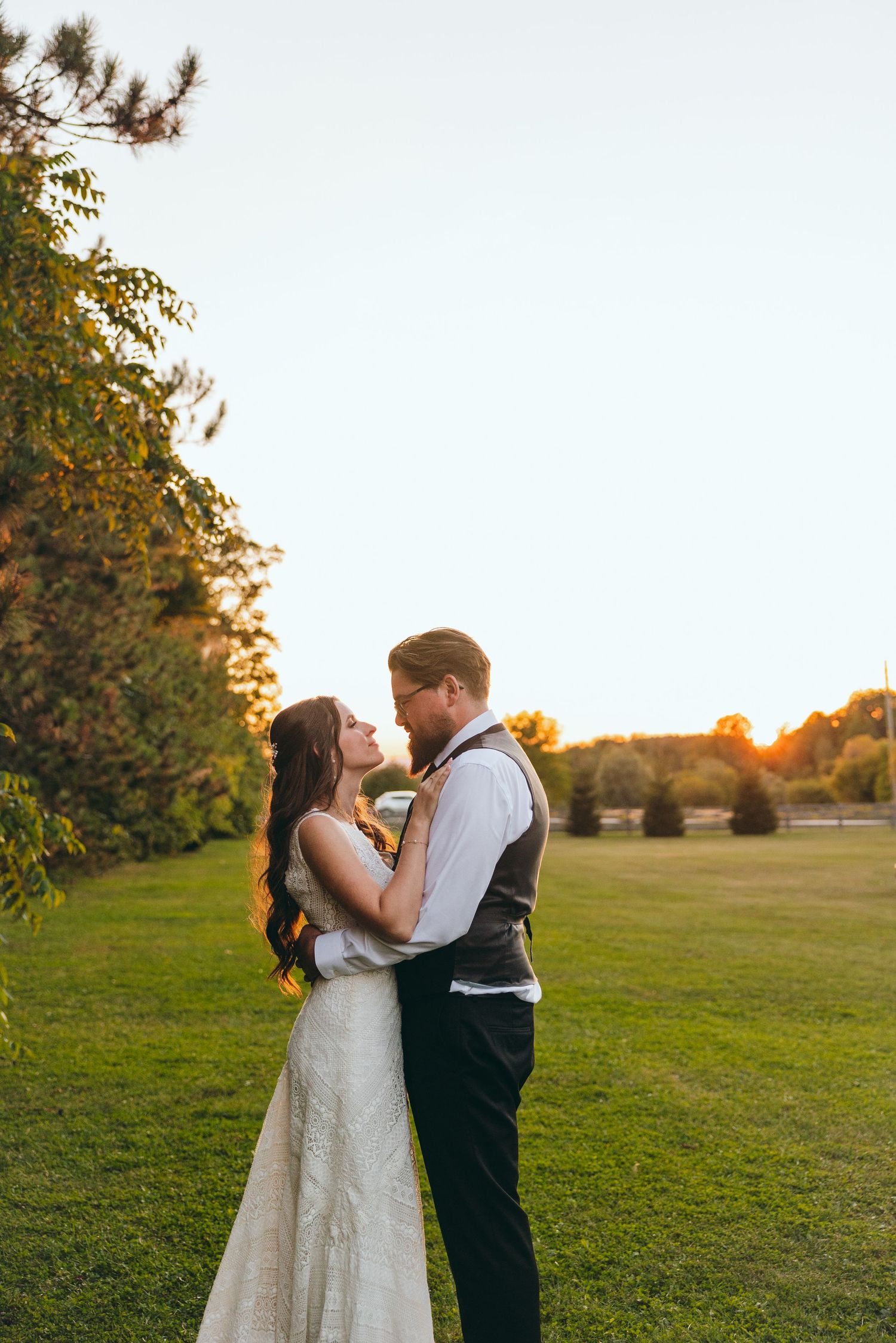 Couple shares a tender moment during their sunset wedding photoshoot.