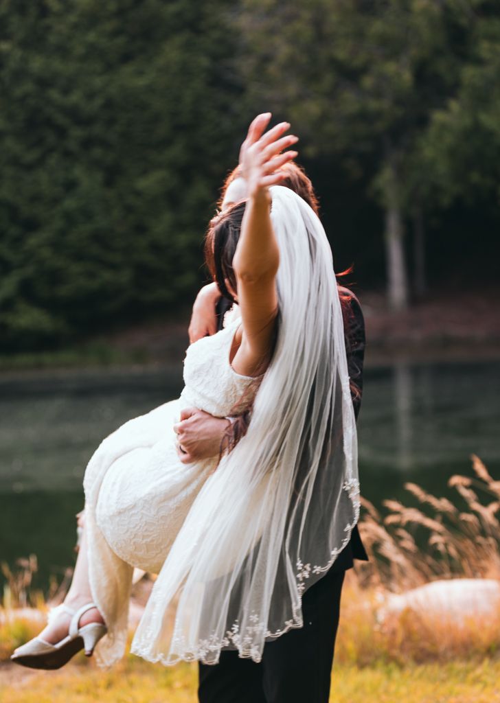 Wedding sequence showing romantic poses with bride in white dress and flowing veil.
