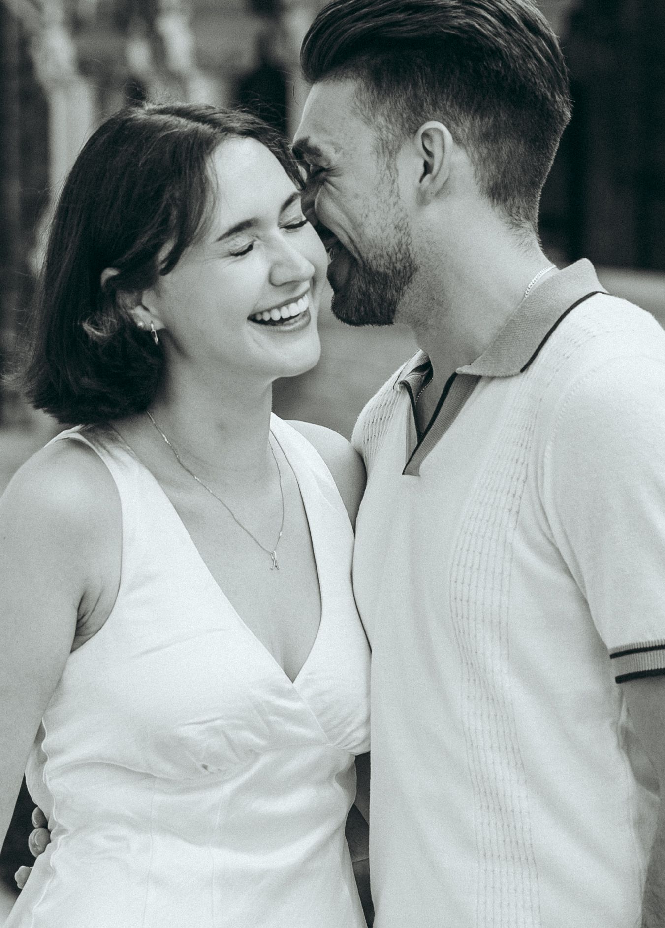 Black and white sequence of a couple sharing intimate moments in casual attire.
