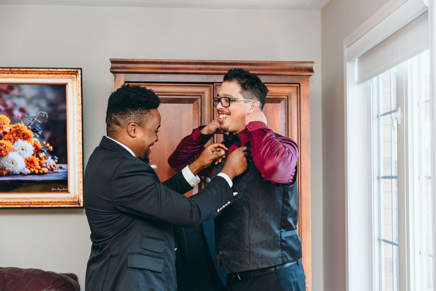 Emotional wedding preparation moments captured in an indoor setting.
