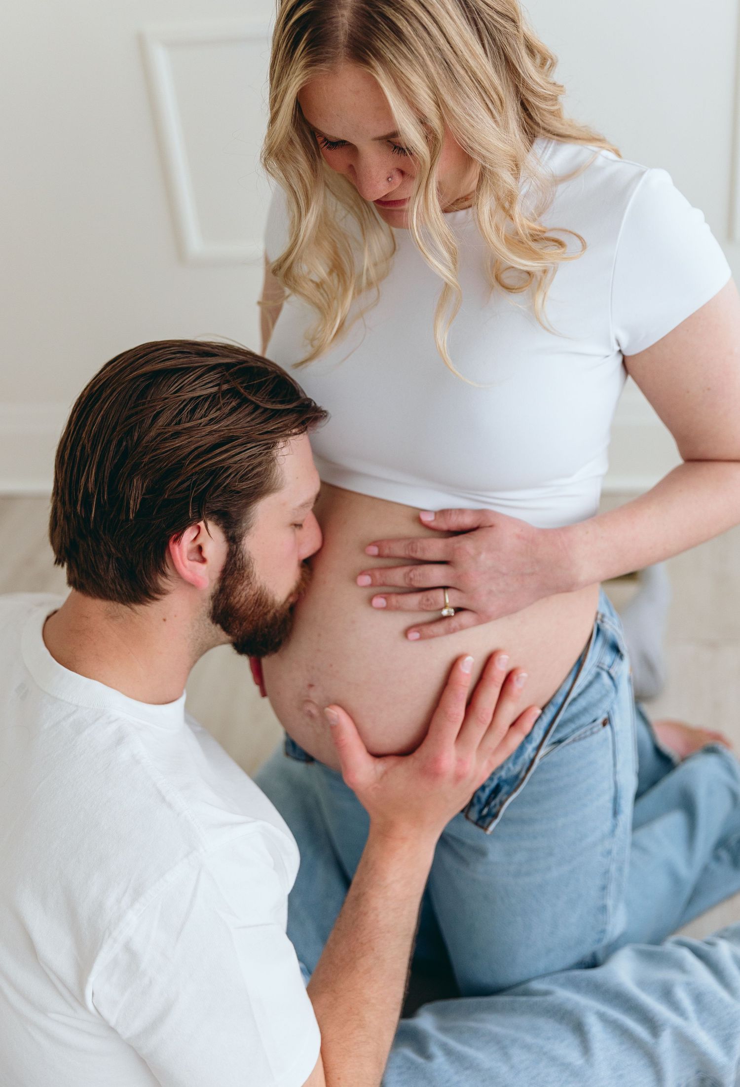 Tender maternity photography sequence showing loving moments between expectant couple.
