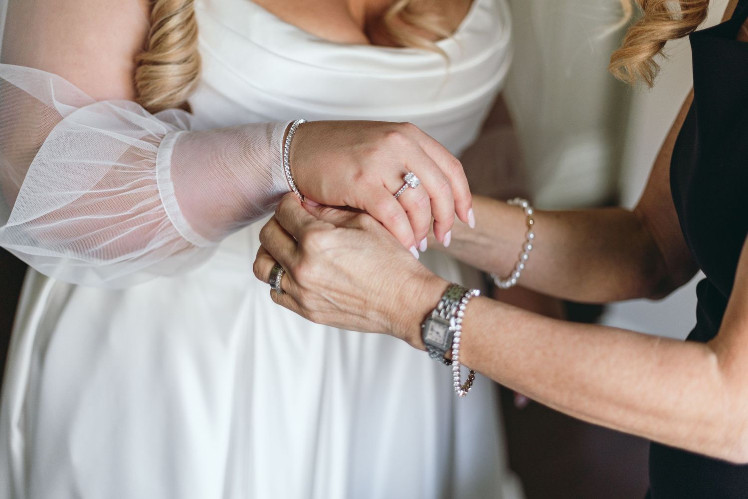 Close-up shots of wedding dress details and final adjustments before the ceremony.
