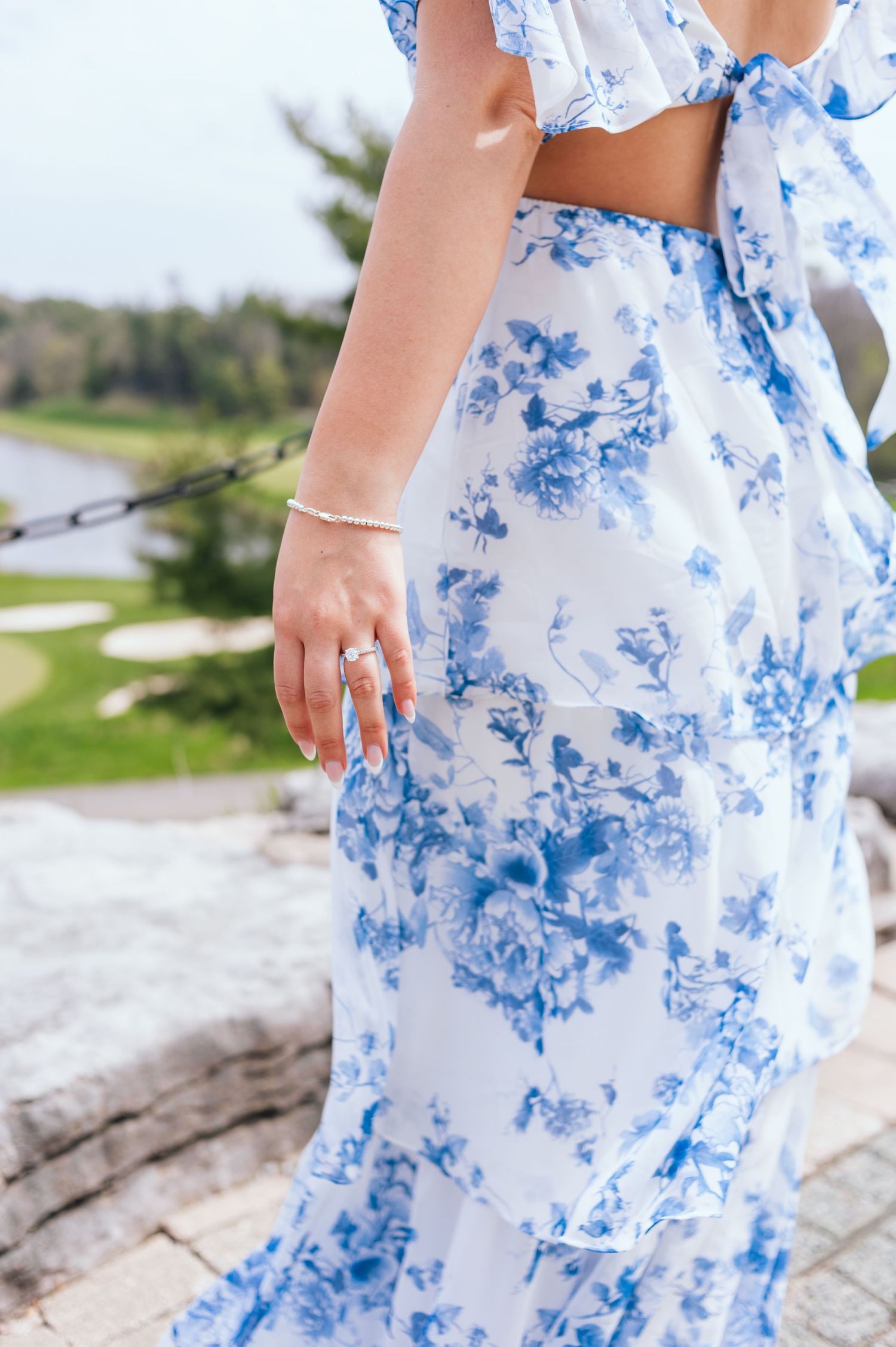Close-up of a blue and white floral pattern dress flowing in the breeze.
