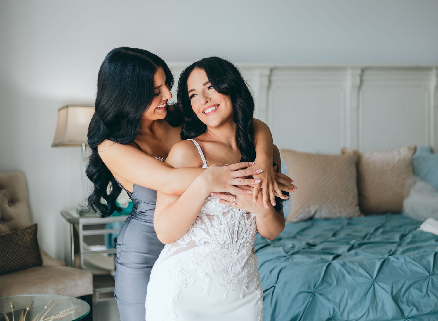 A couple shares intimate moments in a bedroom setting with soft lighting and cozy decor.