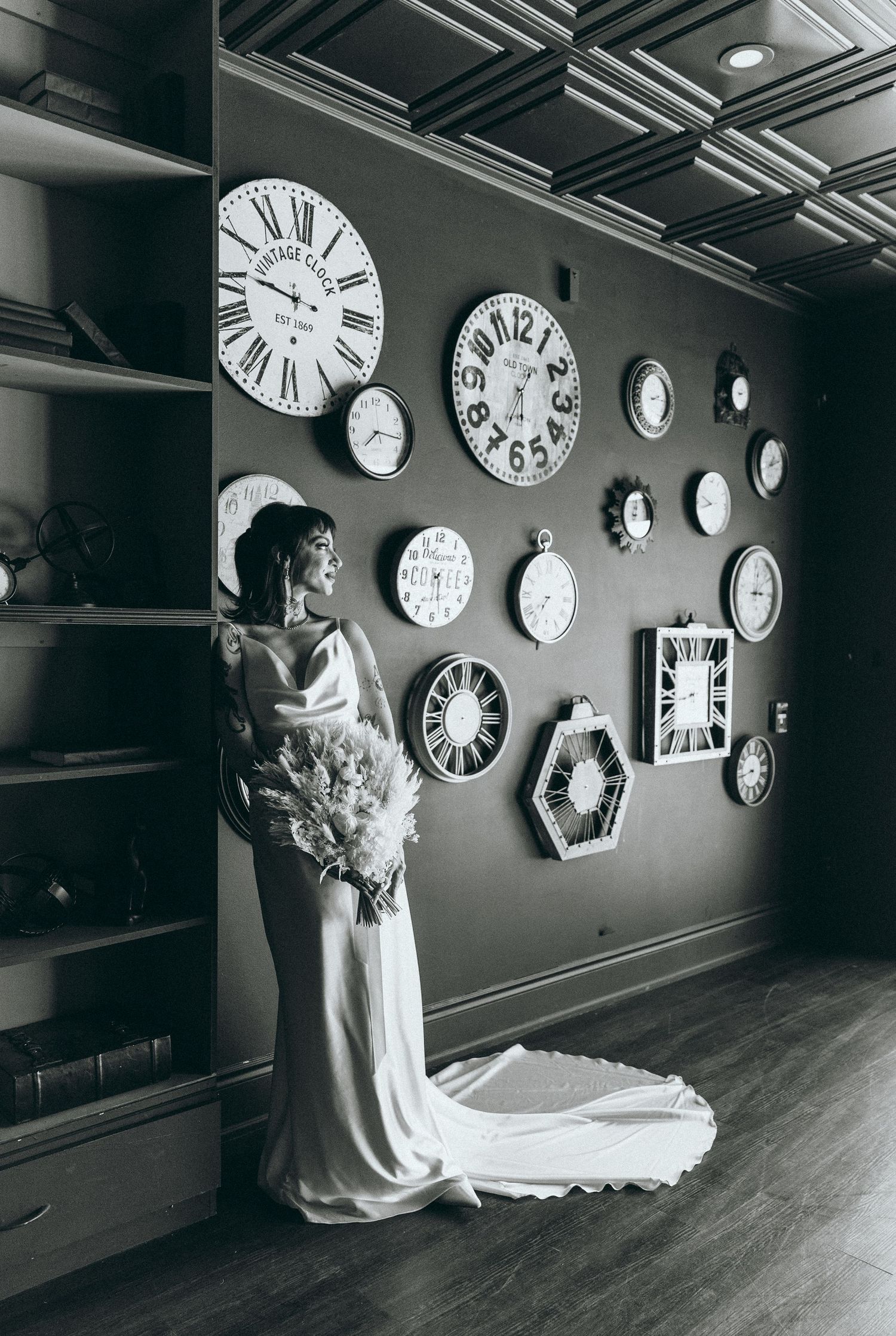 Wedding photos taken in unique venue with vintage clocks decorating the walls.